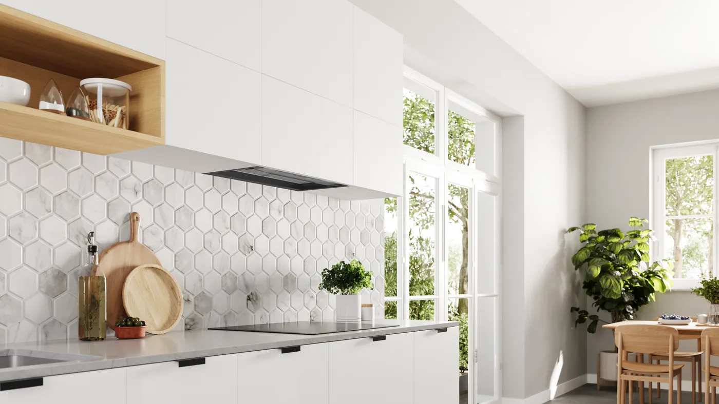 Cocina moderna con gabinetes blancos, azulejos de mármol hexagonales y un área de comedor con mesa de madera.