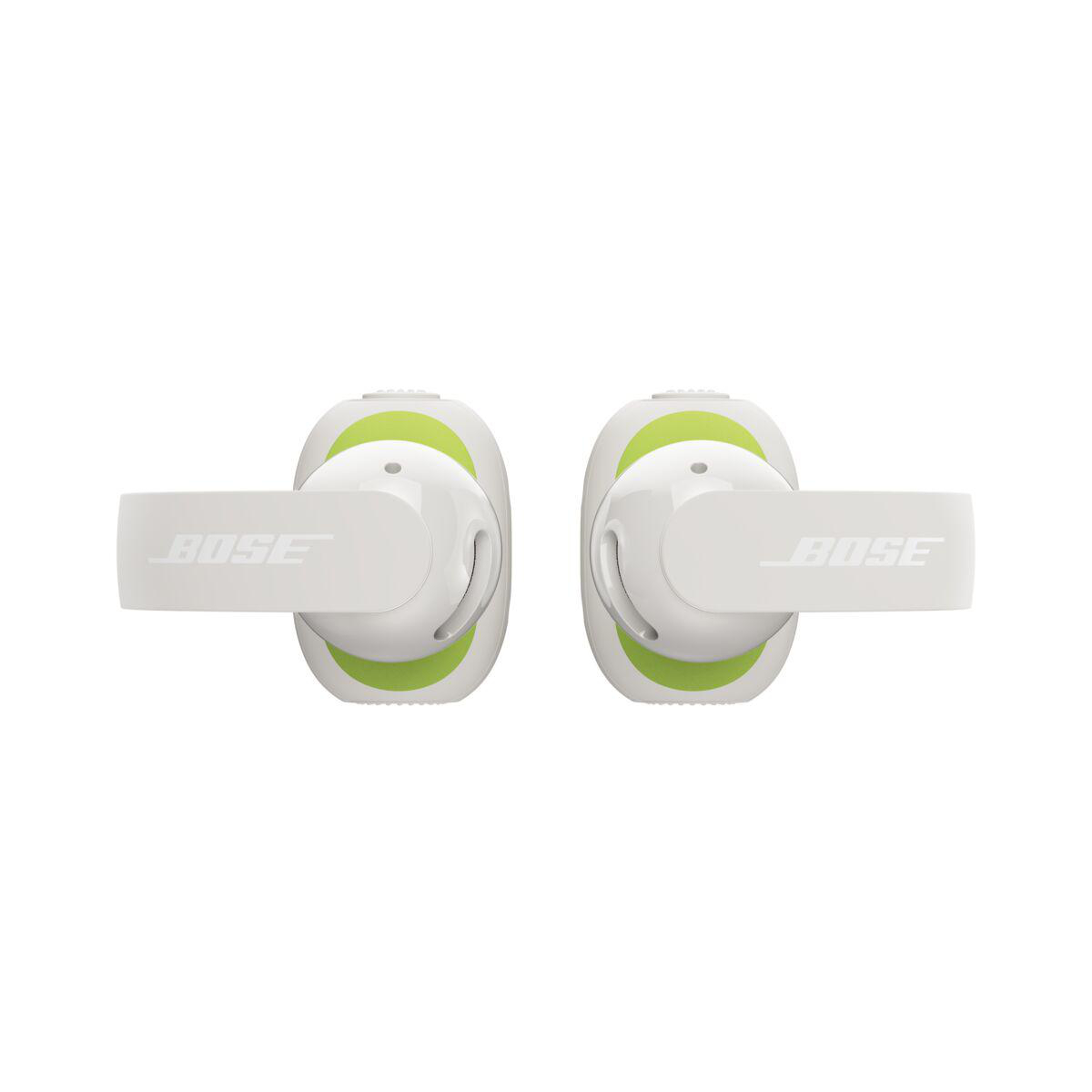 Weisse Bose Ultra Open Earbuds mit hellgrünen Akzenten vor weissem Hintergrund.