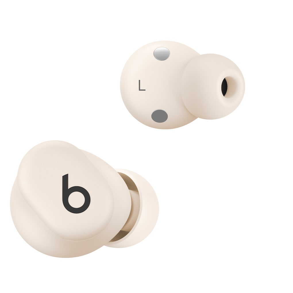 Dos auriculares inalámbricos de color crema sobre fondo blanco, uno con el logotipo de Beats y otro marcado con una L.