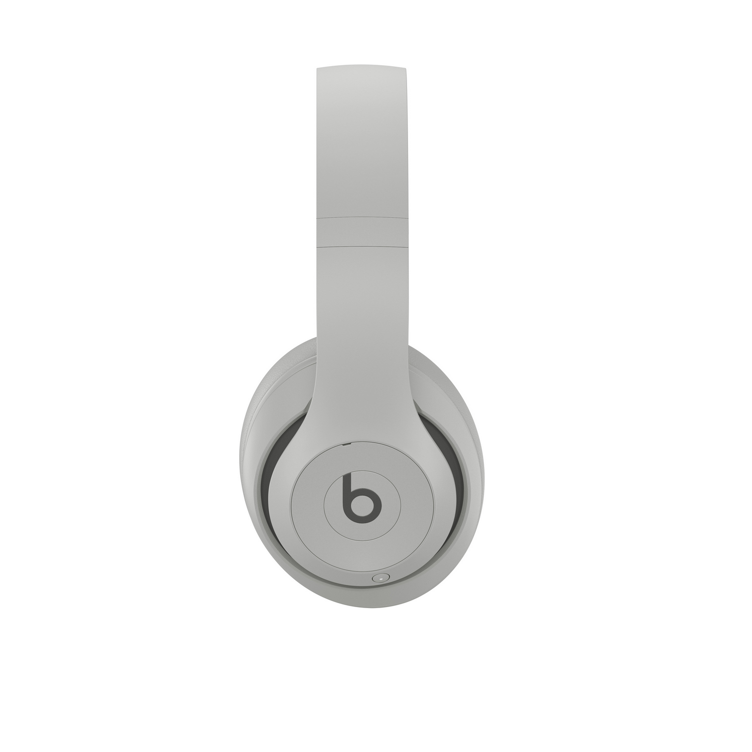 Auriculares grises Beats con el logotipo de la marca en la copa sobre fondo blanco.