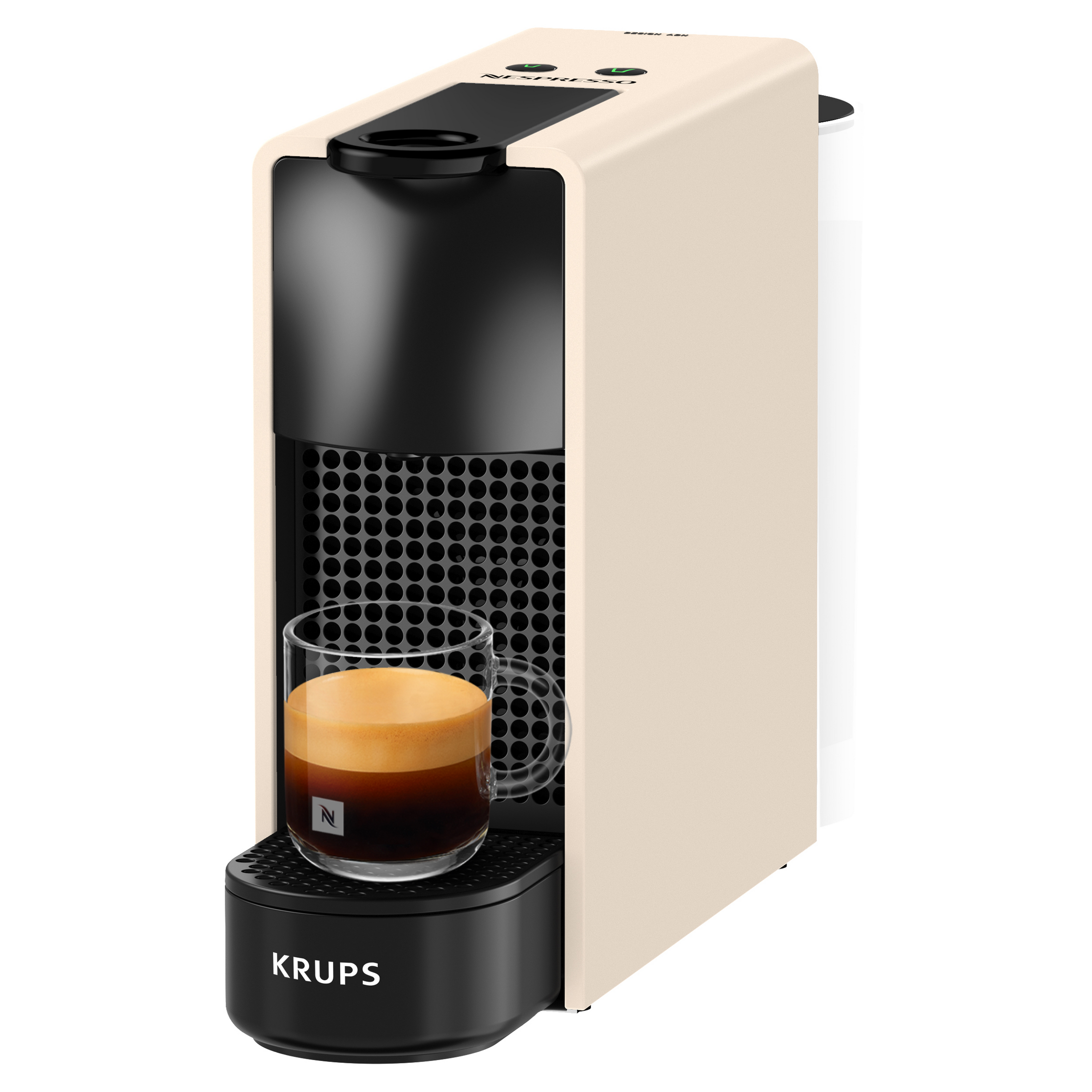 Egy krémfehér és fekete Krups Nespresso kávéfőző üvegpohár friss eszpresszóval a csepptálcán.