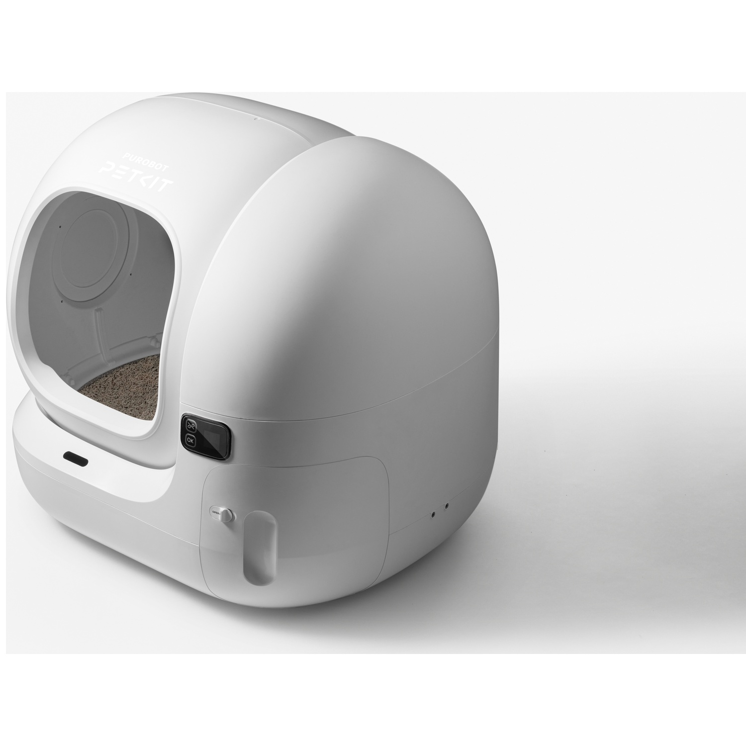 Une litière pour chat automatique blanche et moderne avec une entrée ouverte et un écran intégré.