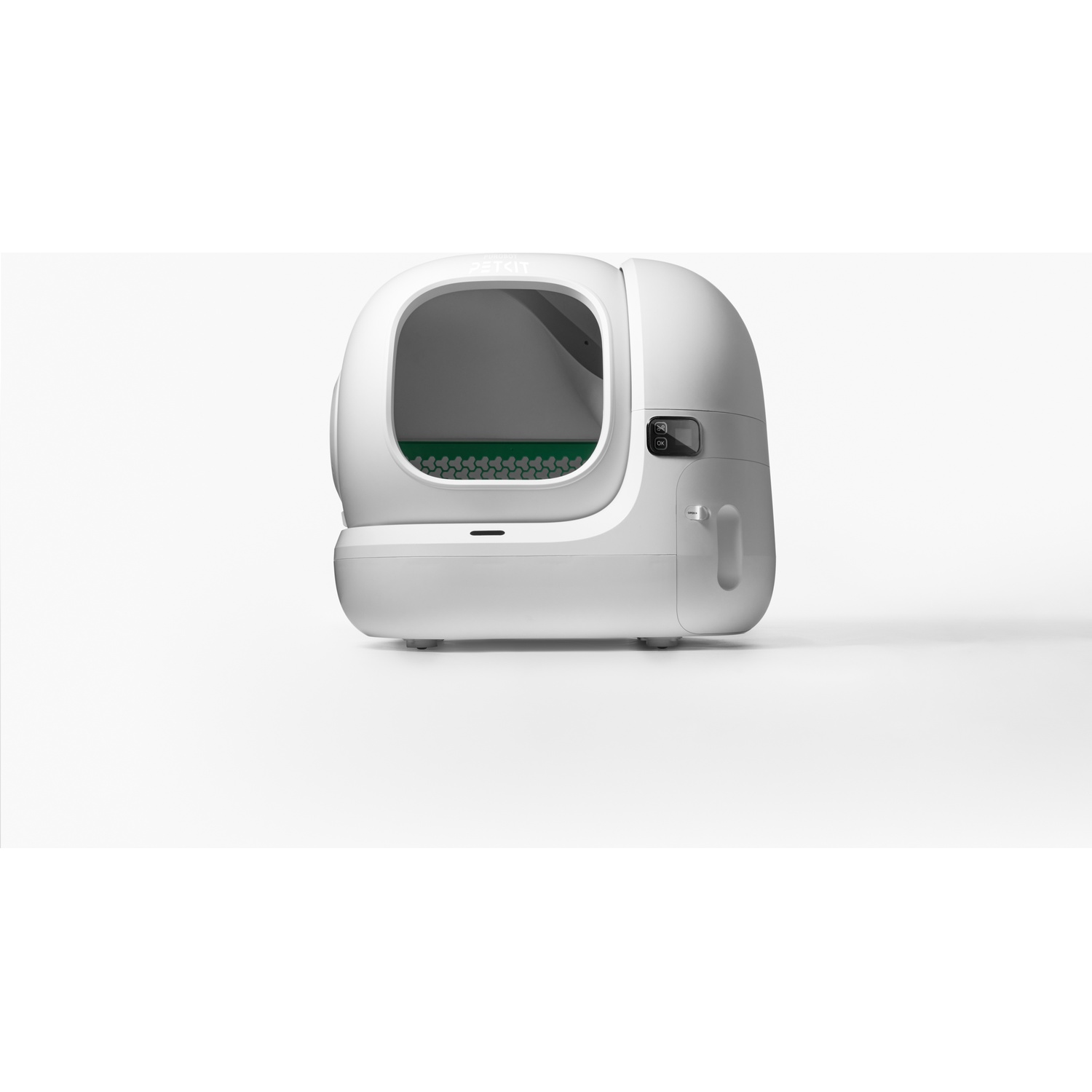 Une capsule de litière pour chat blanche et automatisée avec une entrée ronde et un écran sur fond blanc.