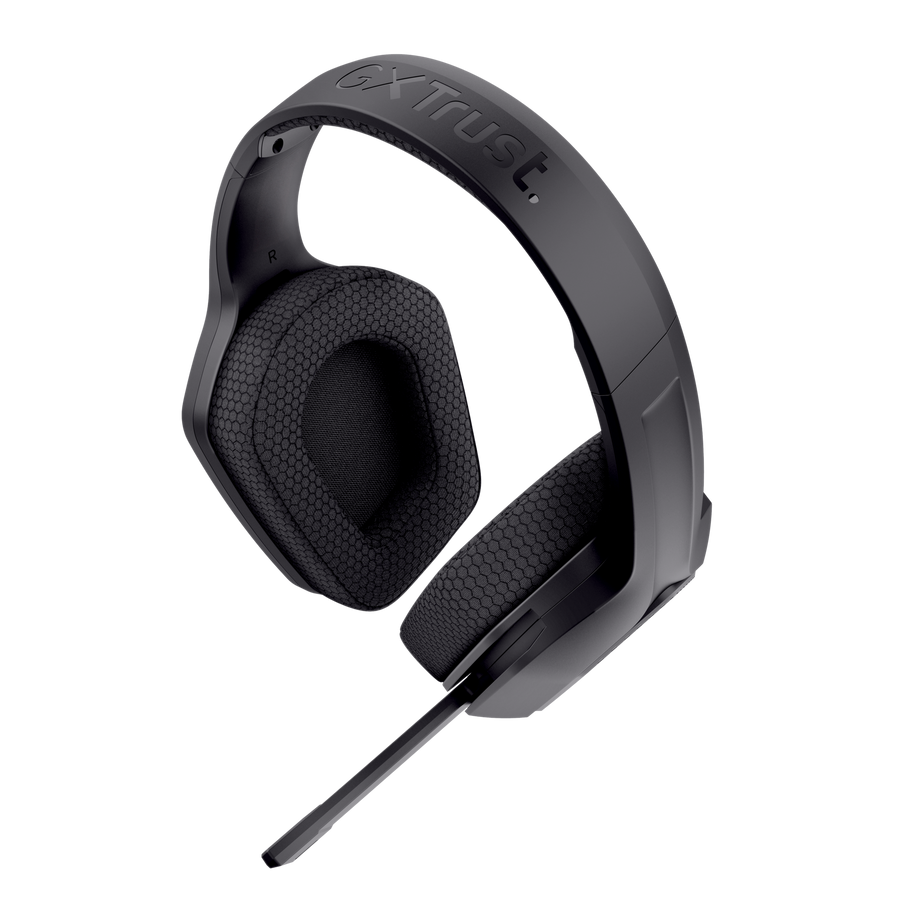 Auriculares gaming supraurales negros con el logotipo de Trust y micrófono sobre fondo negro.