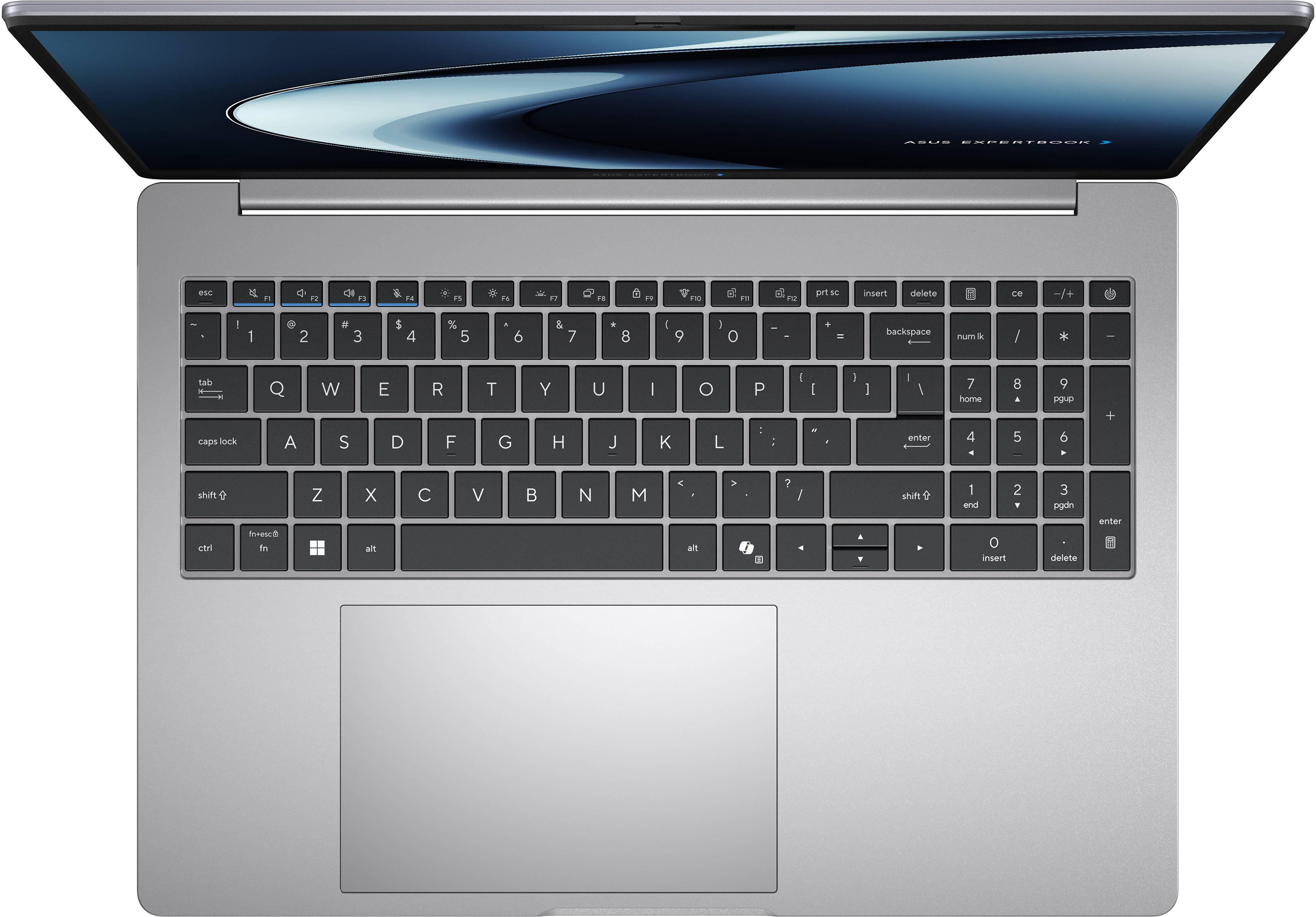 Egy ezüst laptop felülnézete háttérvilágítású billentyűzettel és nagy érintőpaddal.