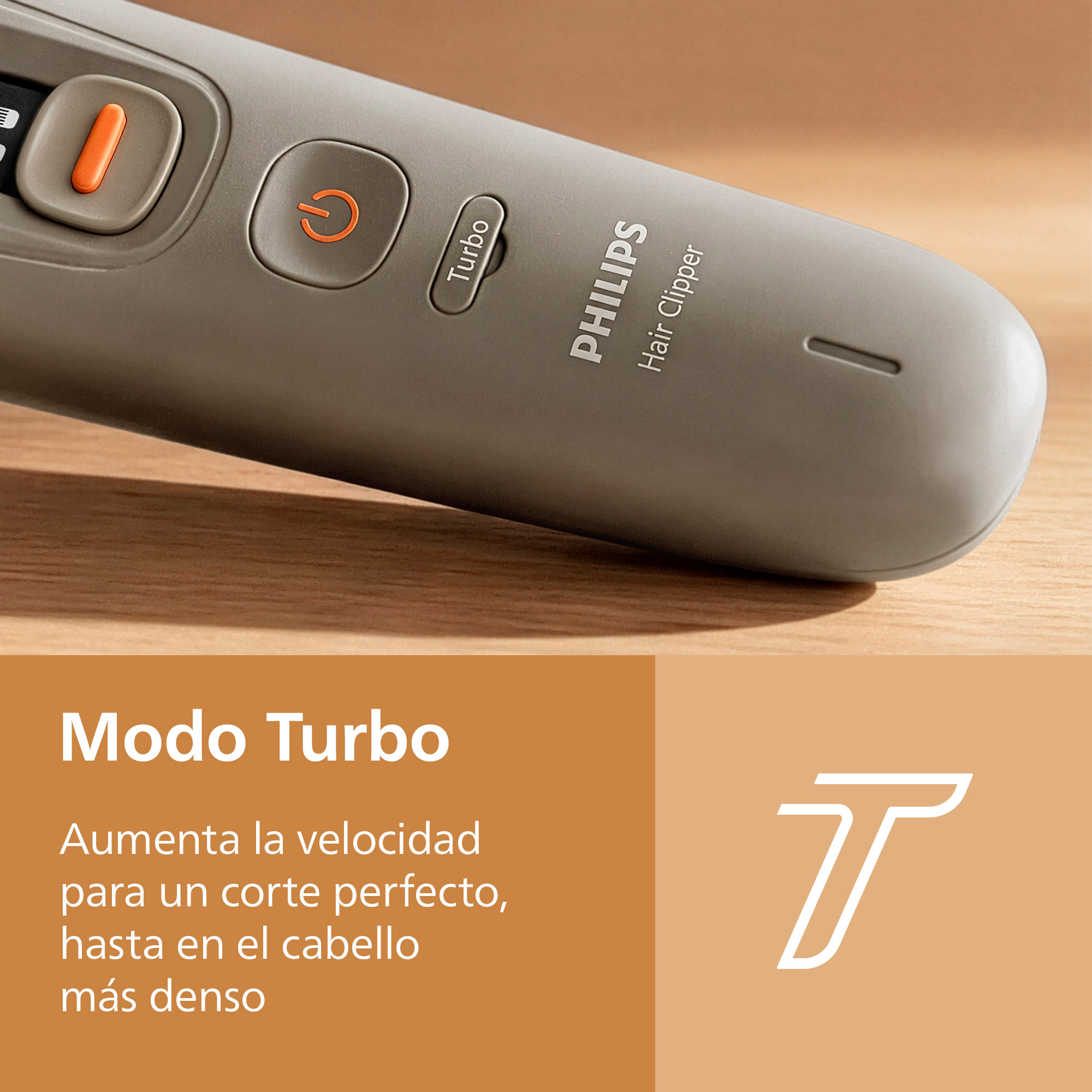 Cortapelos Philips gris con botón turbo sobre superficie de madera.