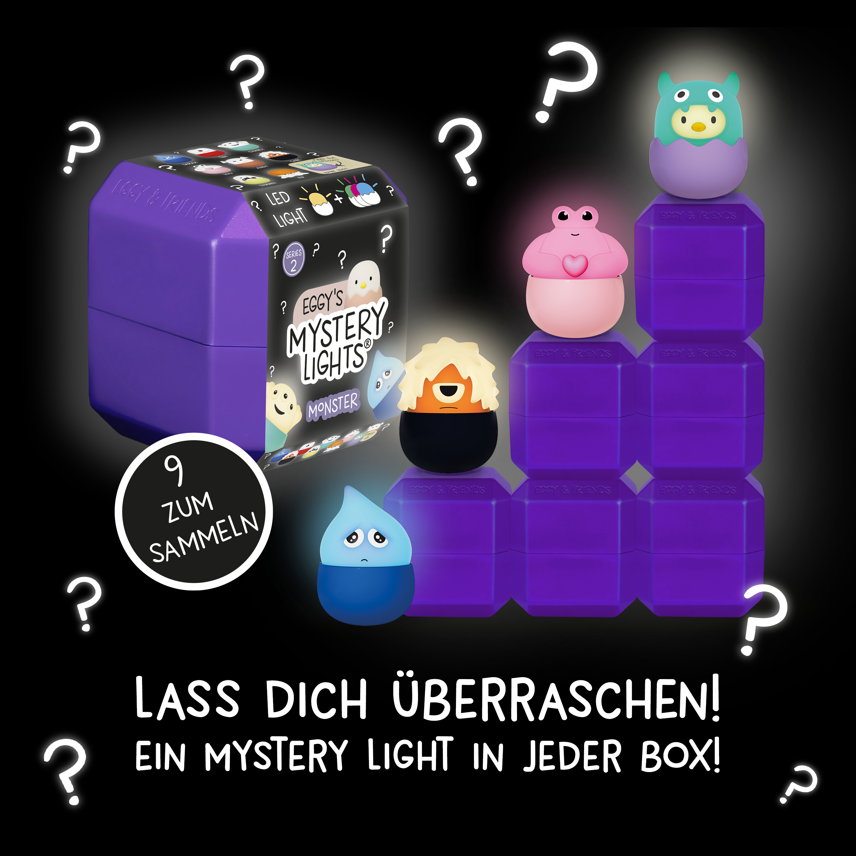 Lila Mystery Boxes mit leuchtenden Figuren wie einem blauen Tropfen, einer rosa Frosch-Figur und einem grünen Monster.