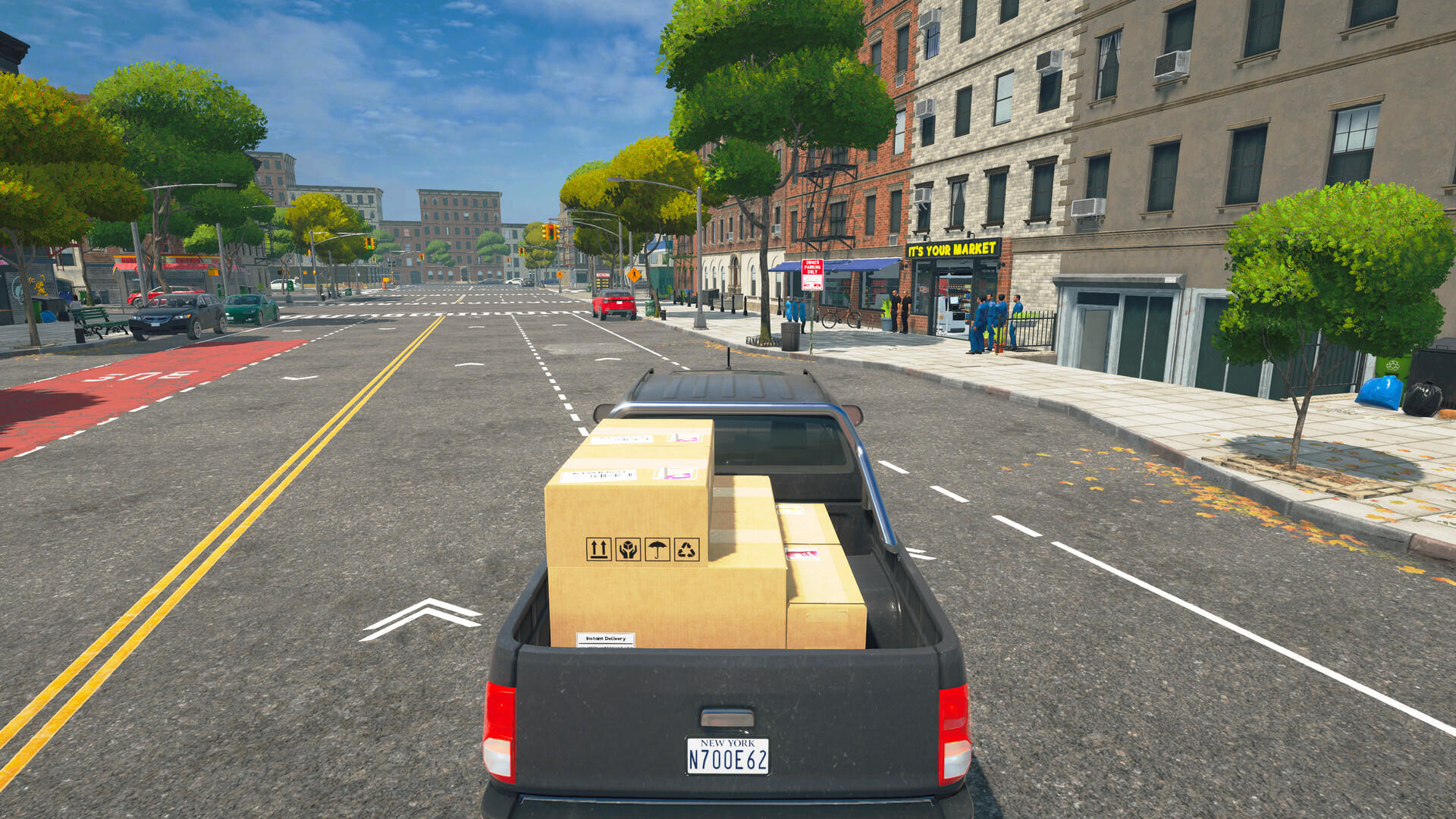 Ein schwarzer Pickup voller Kartons fährt auf einer sonnigen New Yorker Straße.