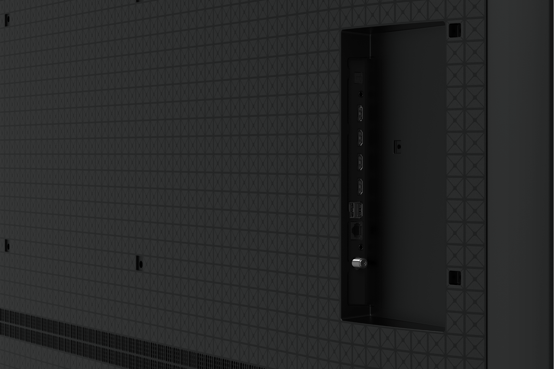 La parte trasera negra de un televisor con patrón texturizado y un panel de puertos lateral.
