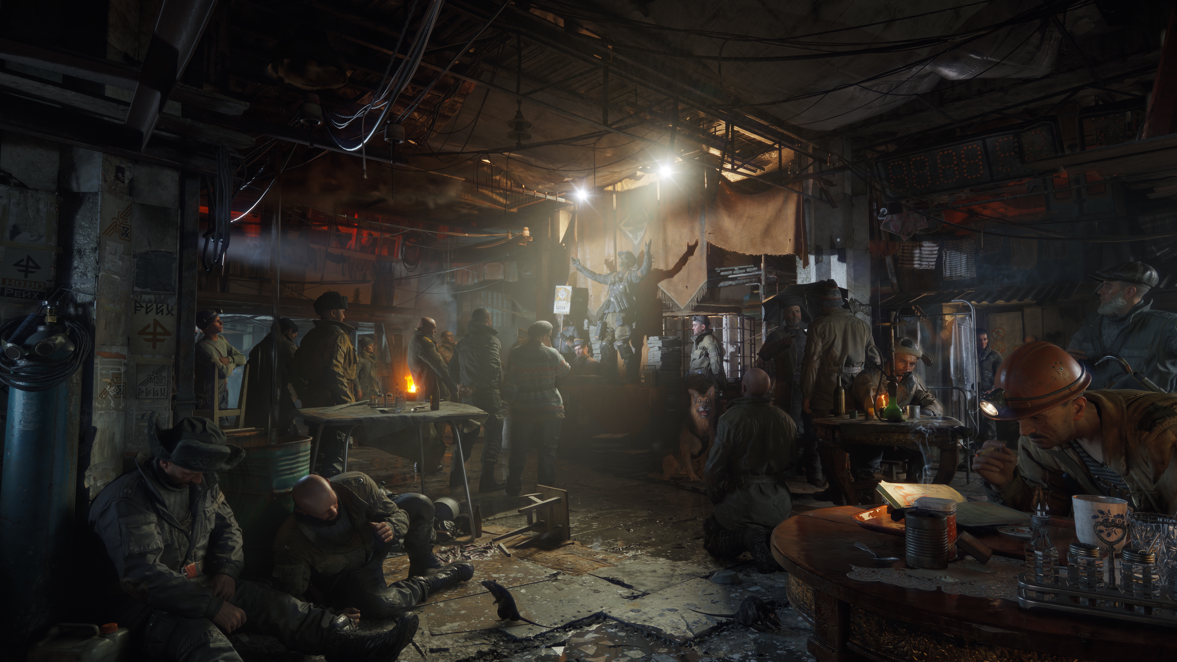 Eine düstere, unterirdische Station mit vielen Menschen, die sich in gedämpftem Licht versammeln.