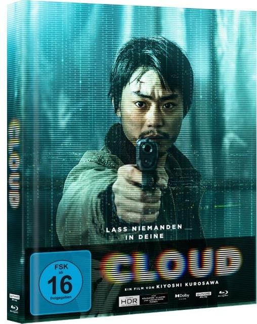 Blu-ray-Hülle mit einem Mann, der vor einem türkisfarbenen Hintergrund mit digitalem Muster eine Waffe auf uns richtet.