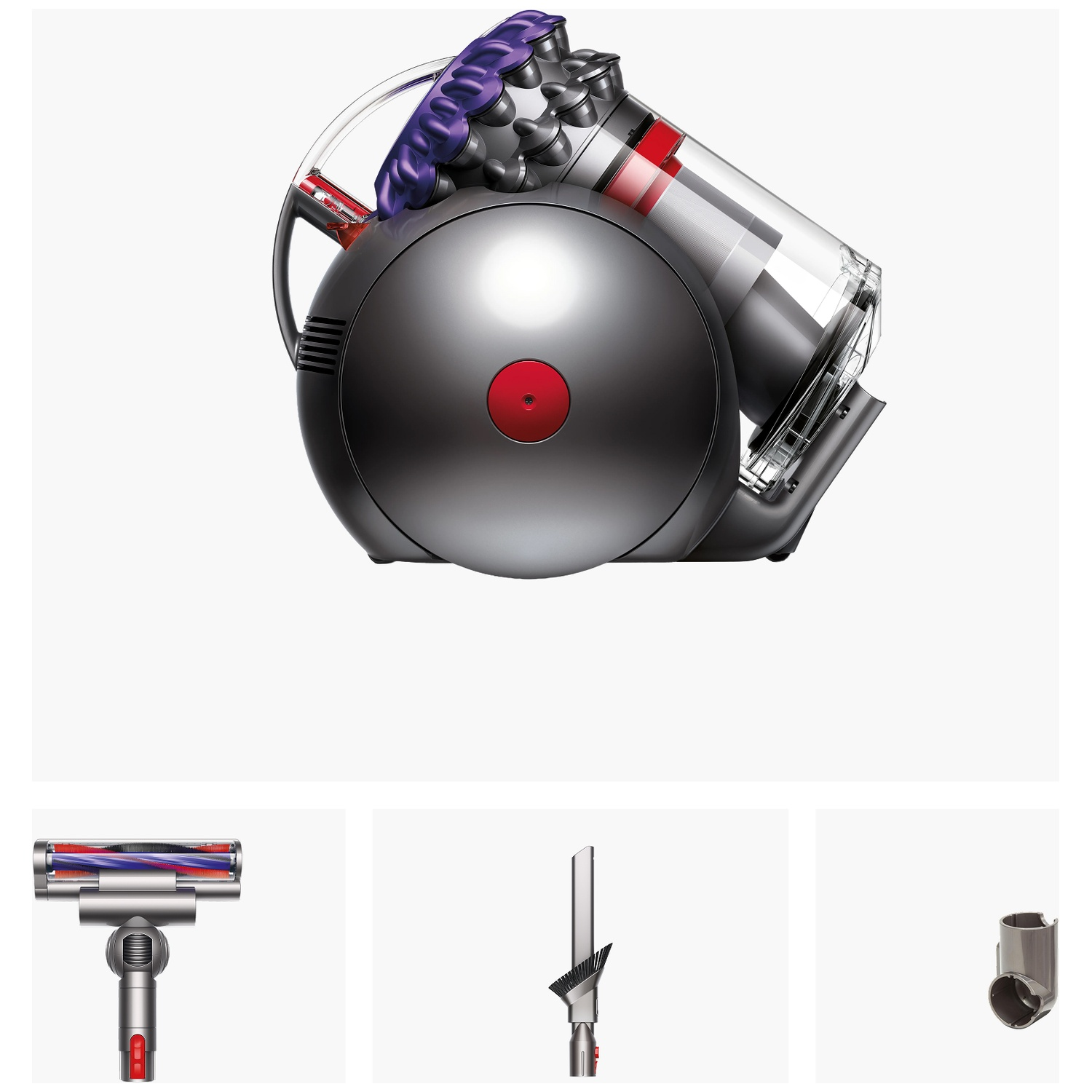 Grey canister vacuum cleaner with accessories like brush and crevice tool on white background.