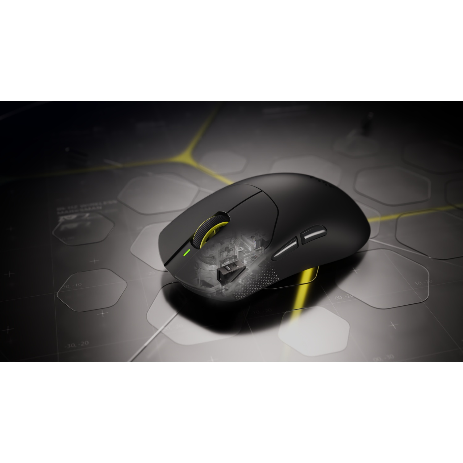 A black wireless gaming mouse resting on a dark surface with hexagonal patterns.