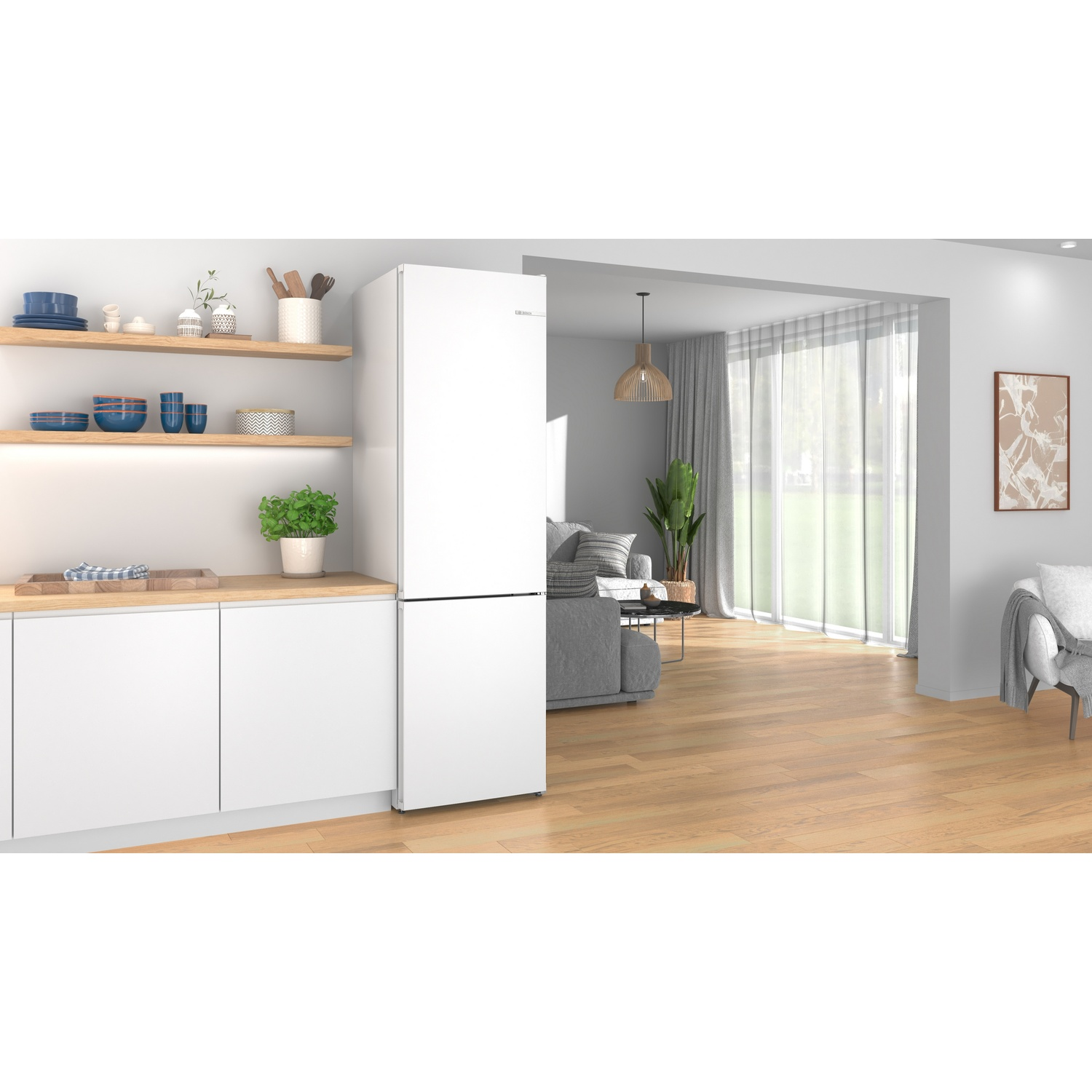 Modern kitchen with a white refrigerator, wooden floors, and an open living room background.