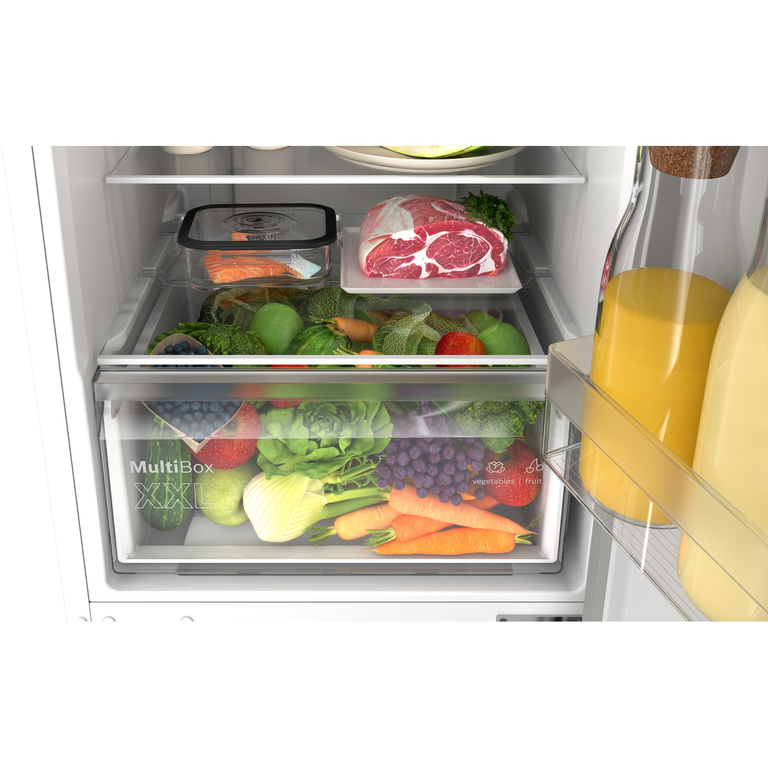 Open refrigerator filled with fresh fruits, vegetables, meat, and bottles of juices.
