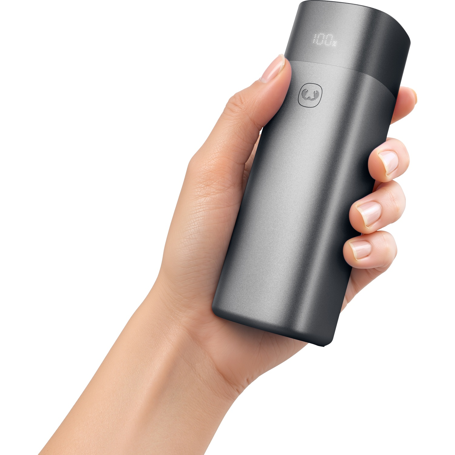 A hand holds a dark, cylindrical power bank with a digital display against a white background.