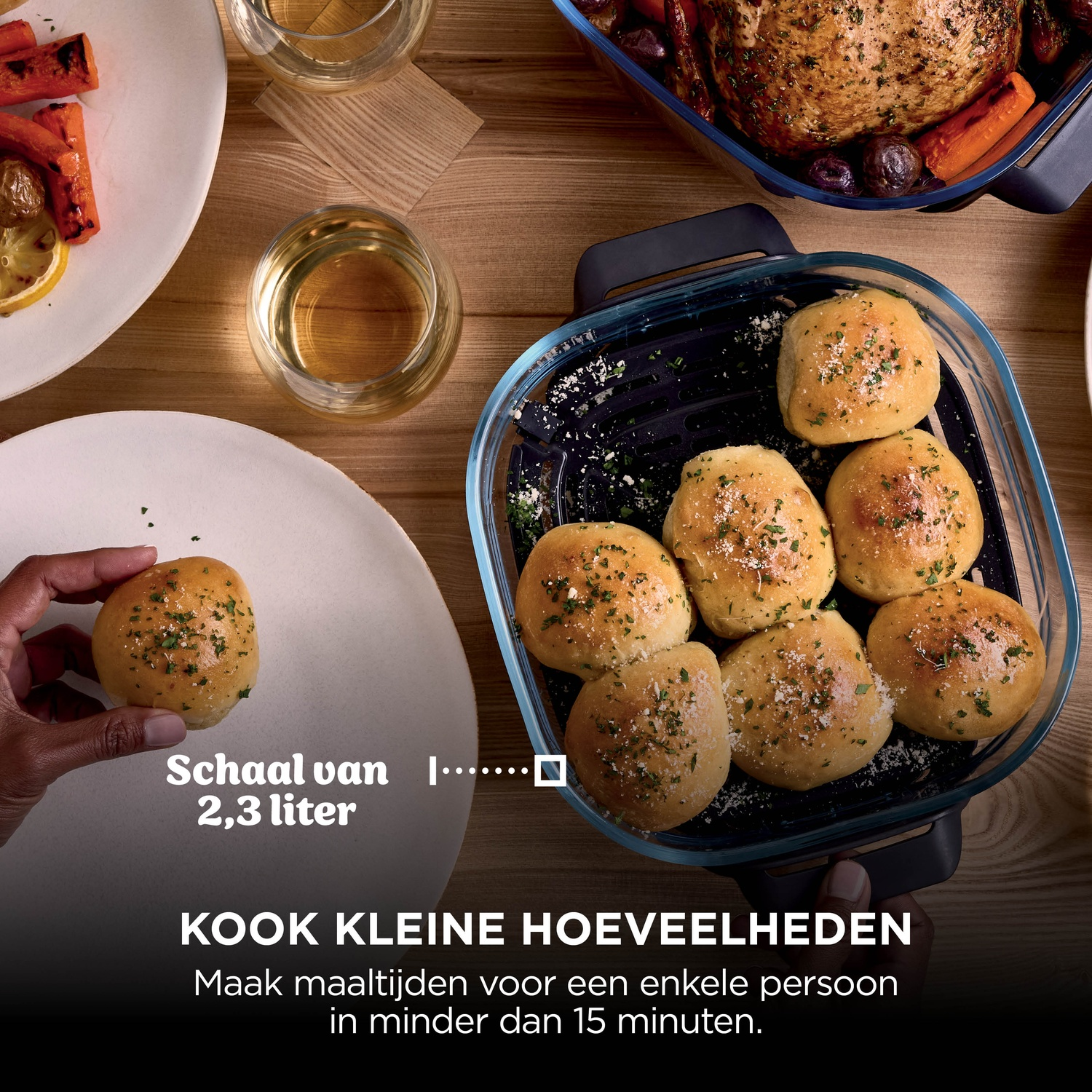 Freshly baked rolls in a glass dish on a wooden table with text.