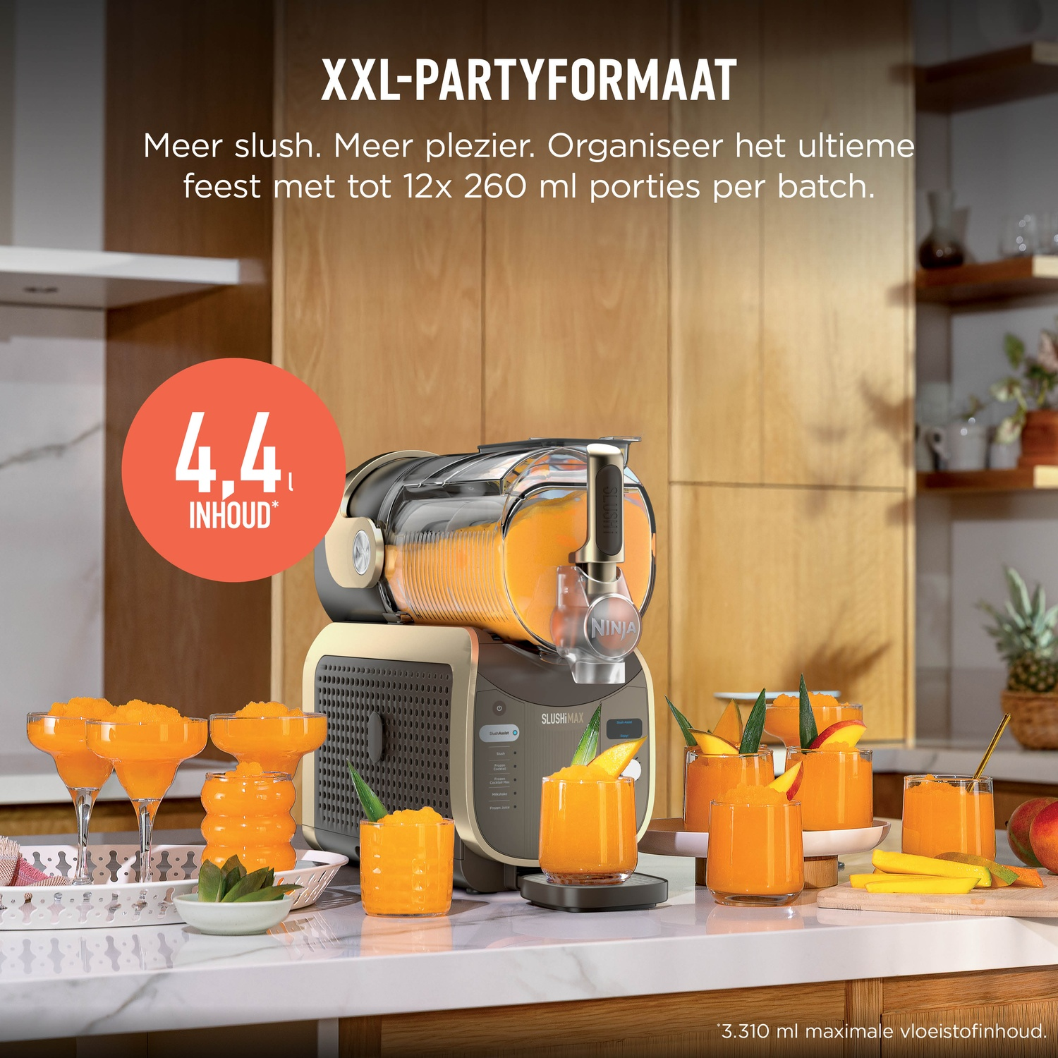 A gold slush machine on a kitchen counter with multiple glasses filled with orange slush drink and fresh fruit slices.