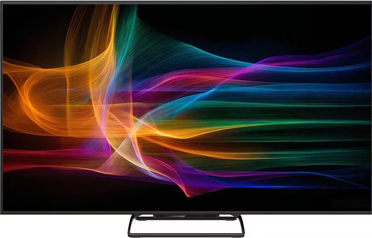 Fekete keretes tévé színes, izzó hullámmintát mutat fekete háttér előtt.