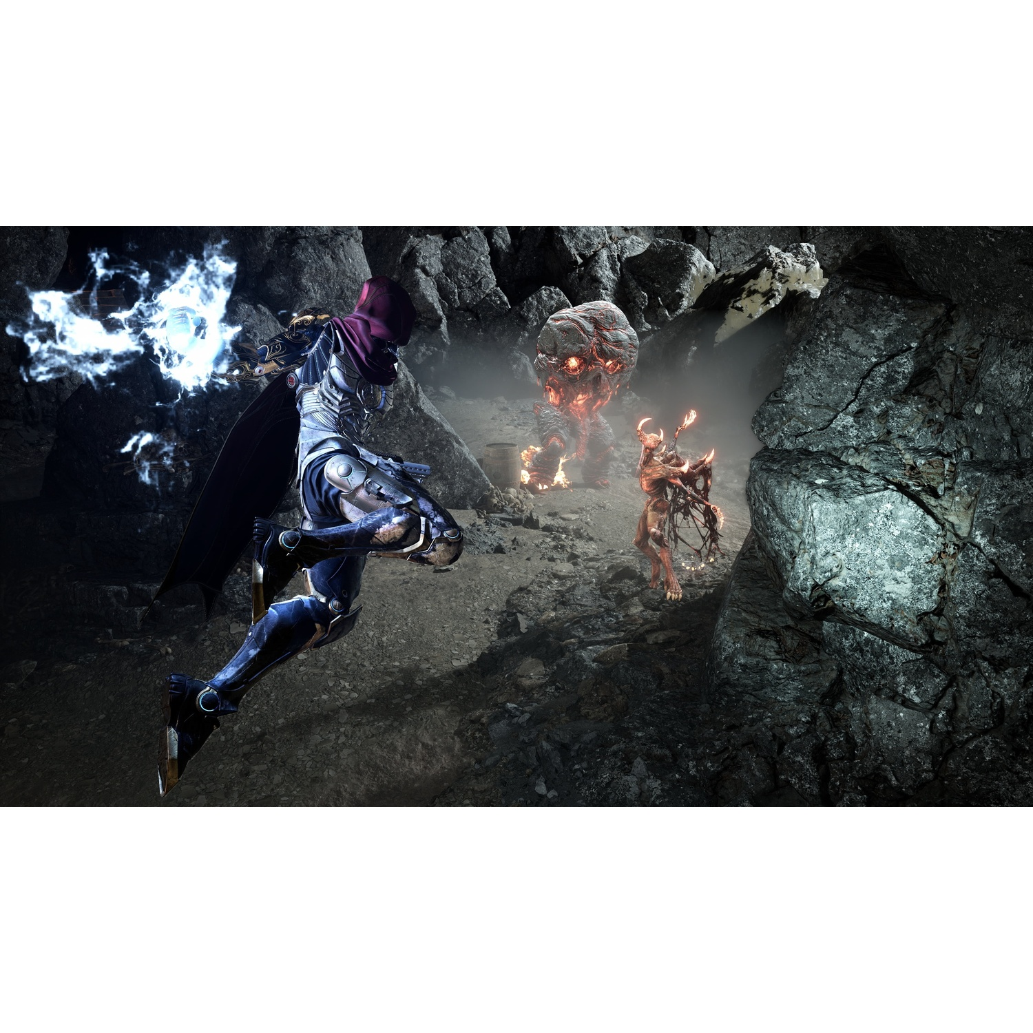 An armored warrior with a red cloak fights fiery monsters inside a rocky cave.