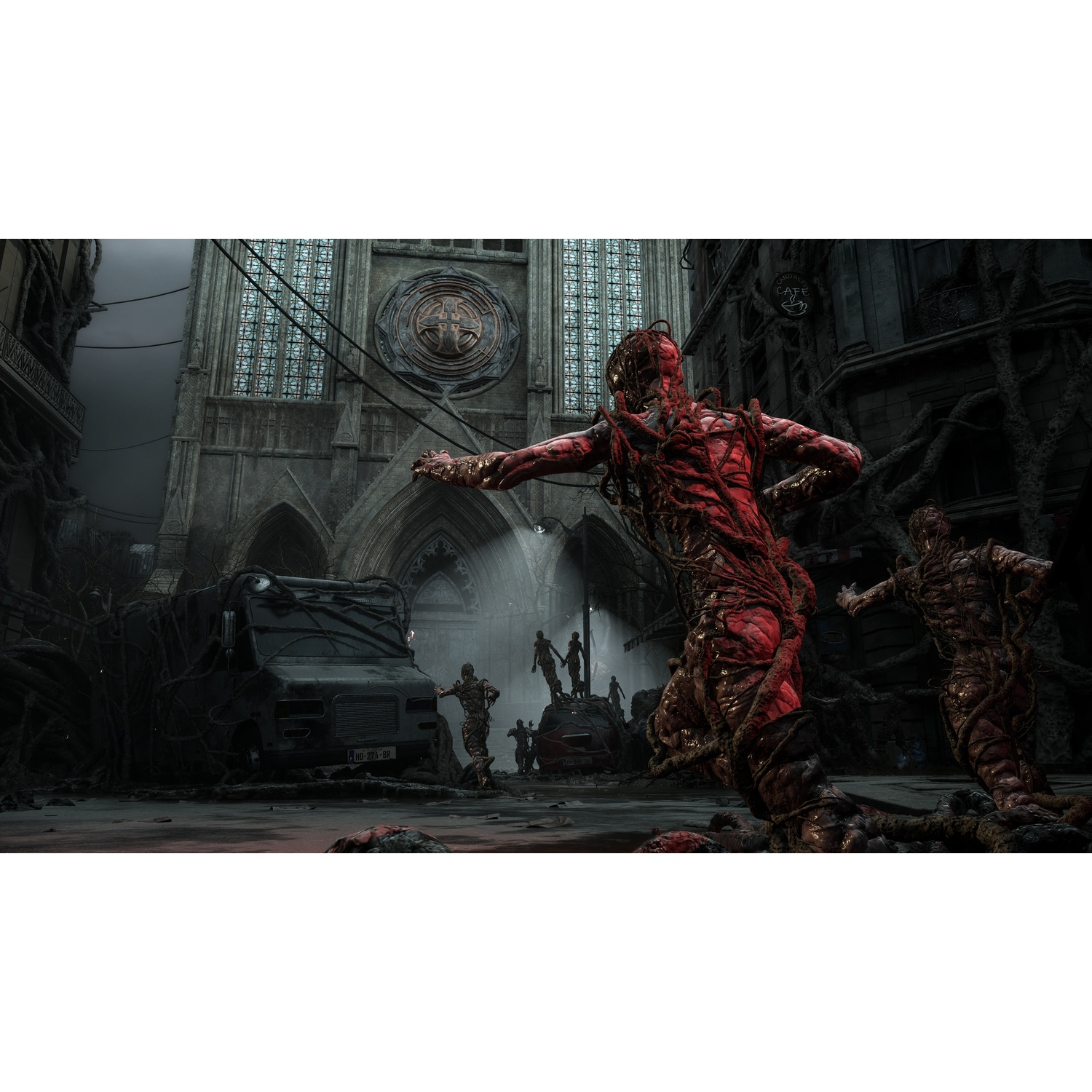 Mutated red creatures in a ruined city before a large Gothic church.