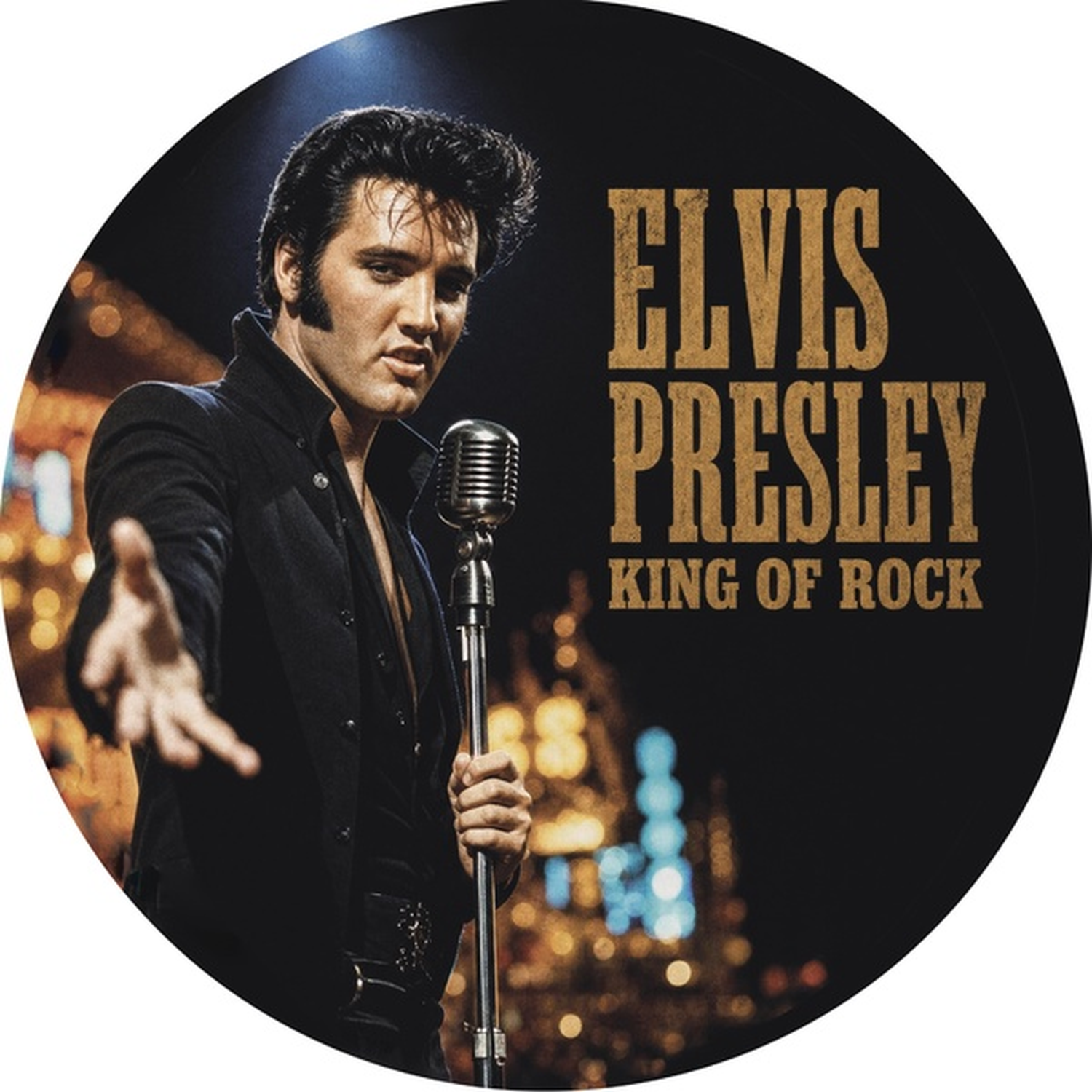 Elvis Presley in black clothing sings into a microphone against a blurred background.