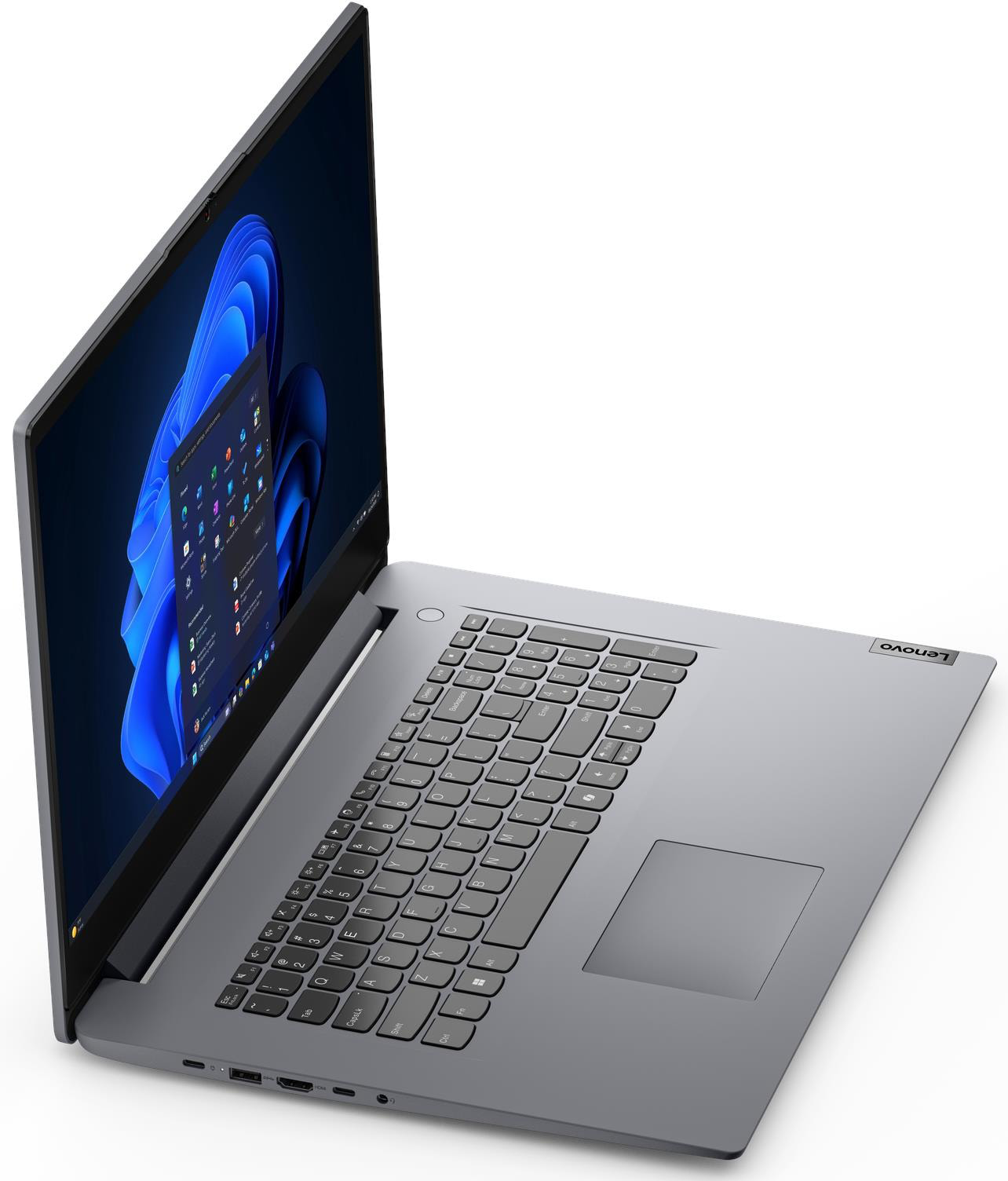 Nyitott ezüst Lenovo laptop fehér felületen, kék absztrakt háttérképpel a képernyőn.
