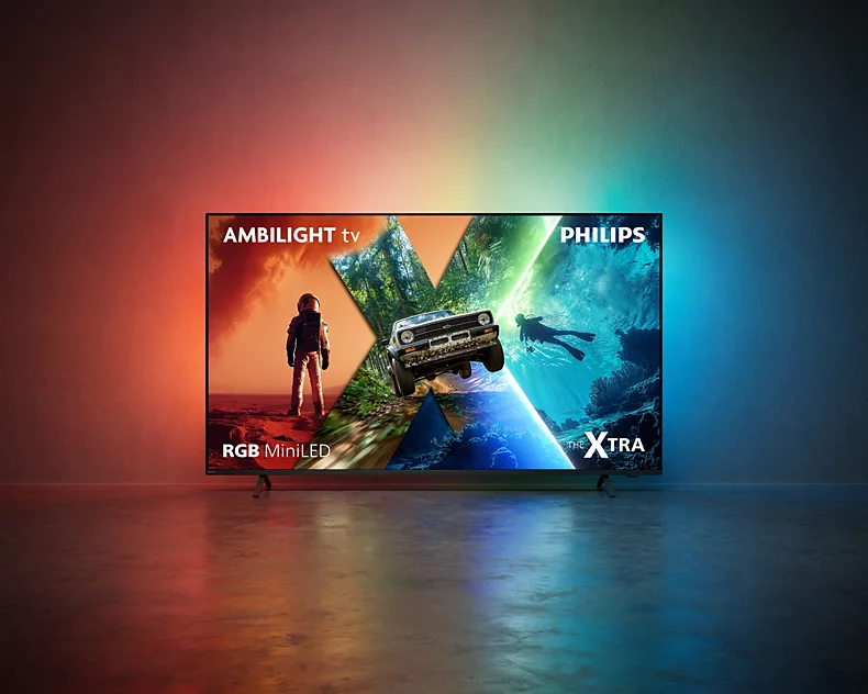 Ein Philips Ambilight Fernseher steht auf dem Boden und projiziert farbiges Licht an die Wand.
