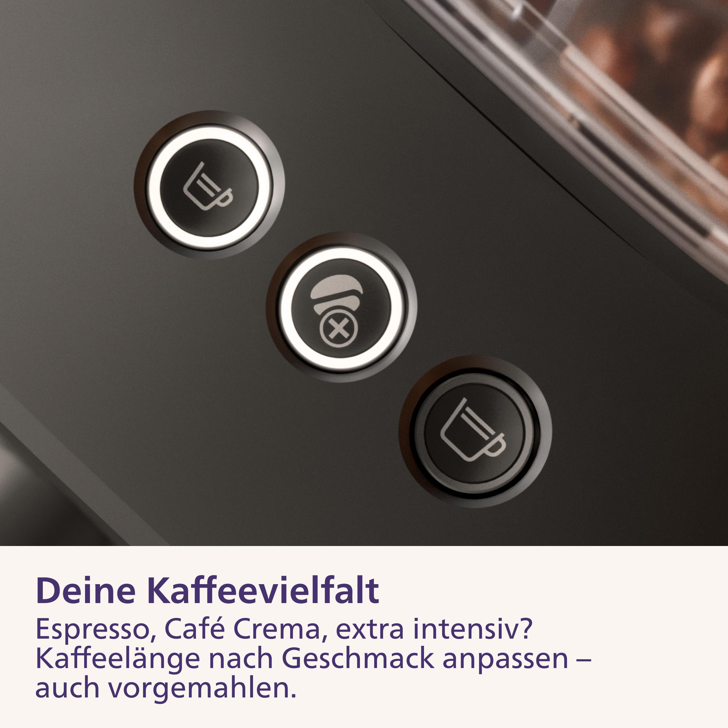 Drei runde Knöpfe mit Kaffeesymbolen auf einer dunklen Kaffeemaschine mit deutschem Text unten.