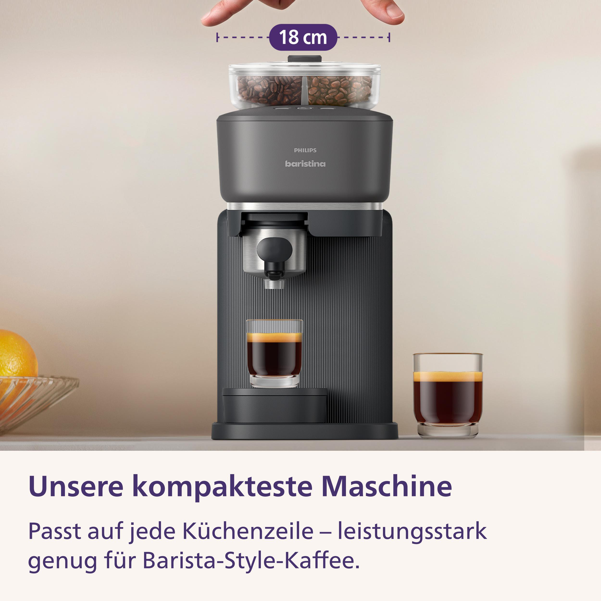 Kompakte dunkle Philips Baristina Kaffeemaschine mit Kaffeebohnenbehälter und zwei Espressogläsern.