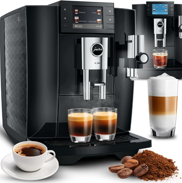 Czarny ekspres do kawy Jura parzący dwie filiżanki espresso, z ziarnami kawy i filiżanką.