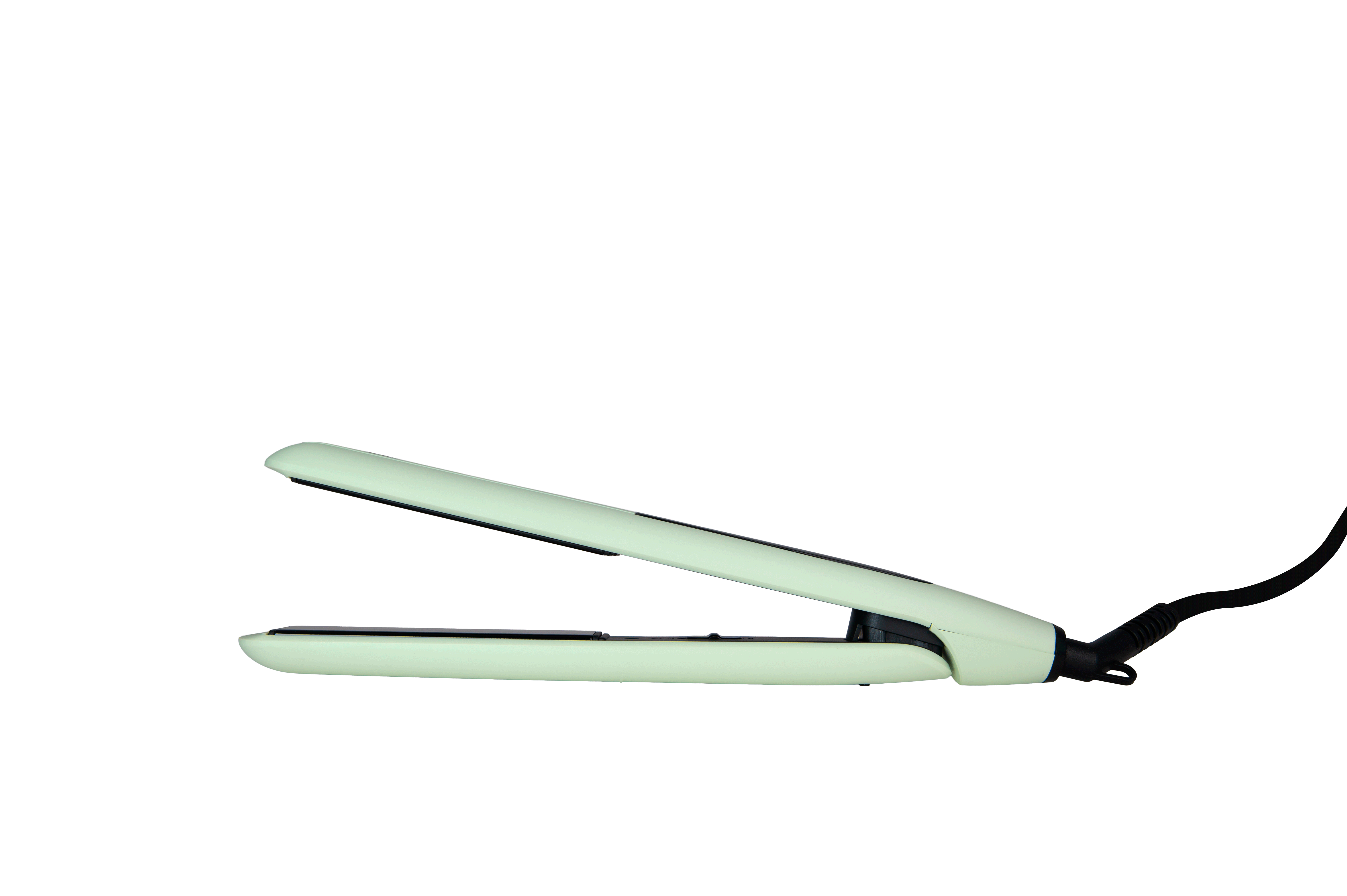 Una plancha de pelo verde claro con placas negras, abierta sobre fondo negro.