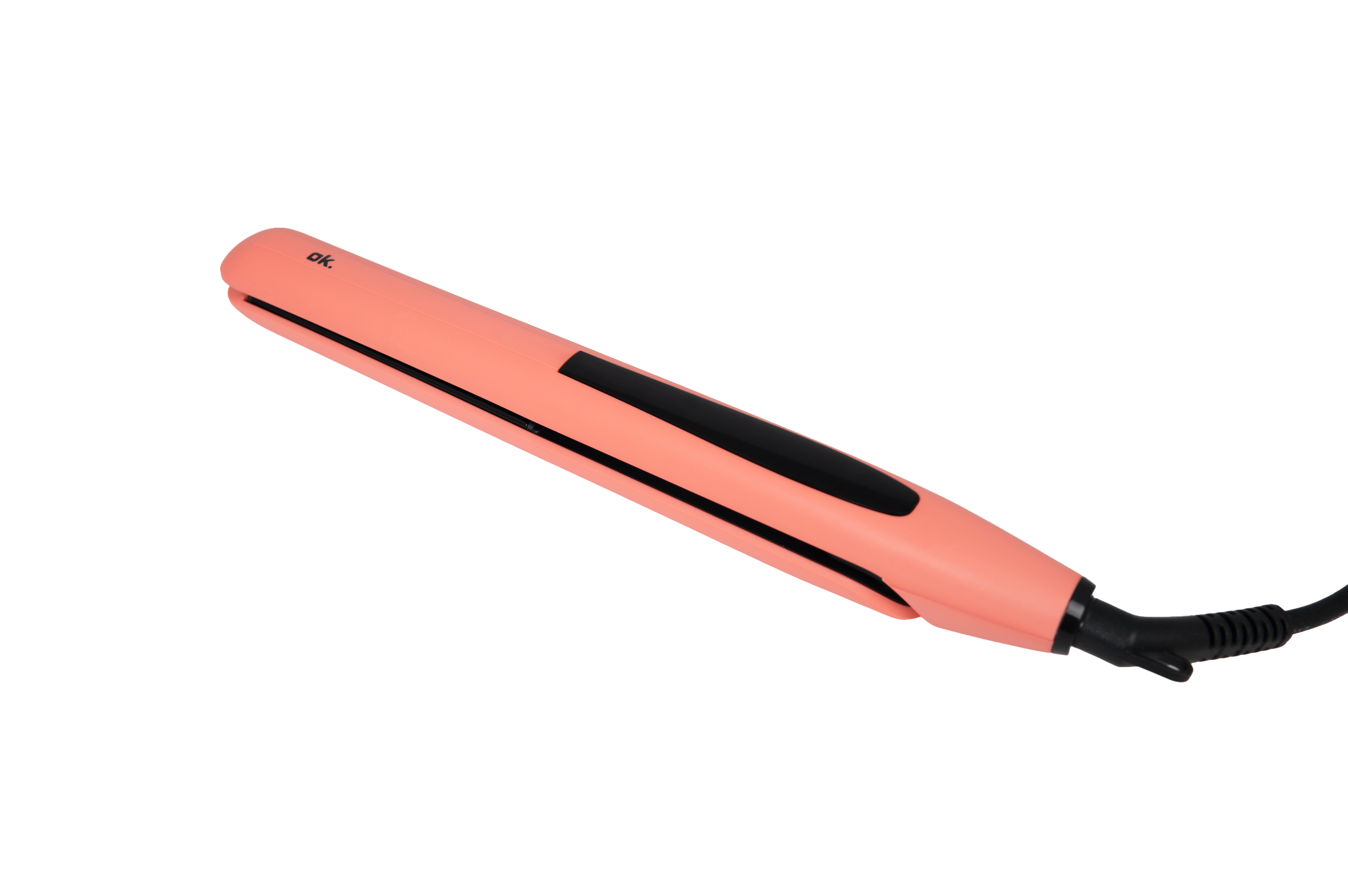 Una plancha de pelo de color rosa melocotón y negro sobre fondo negro.