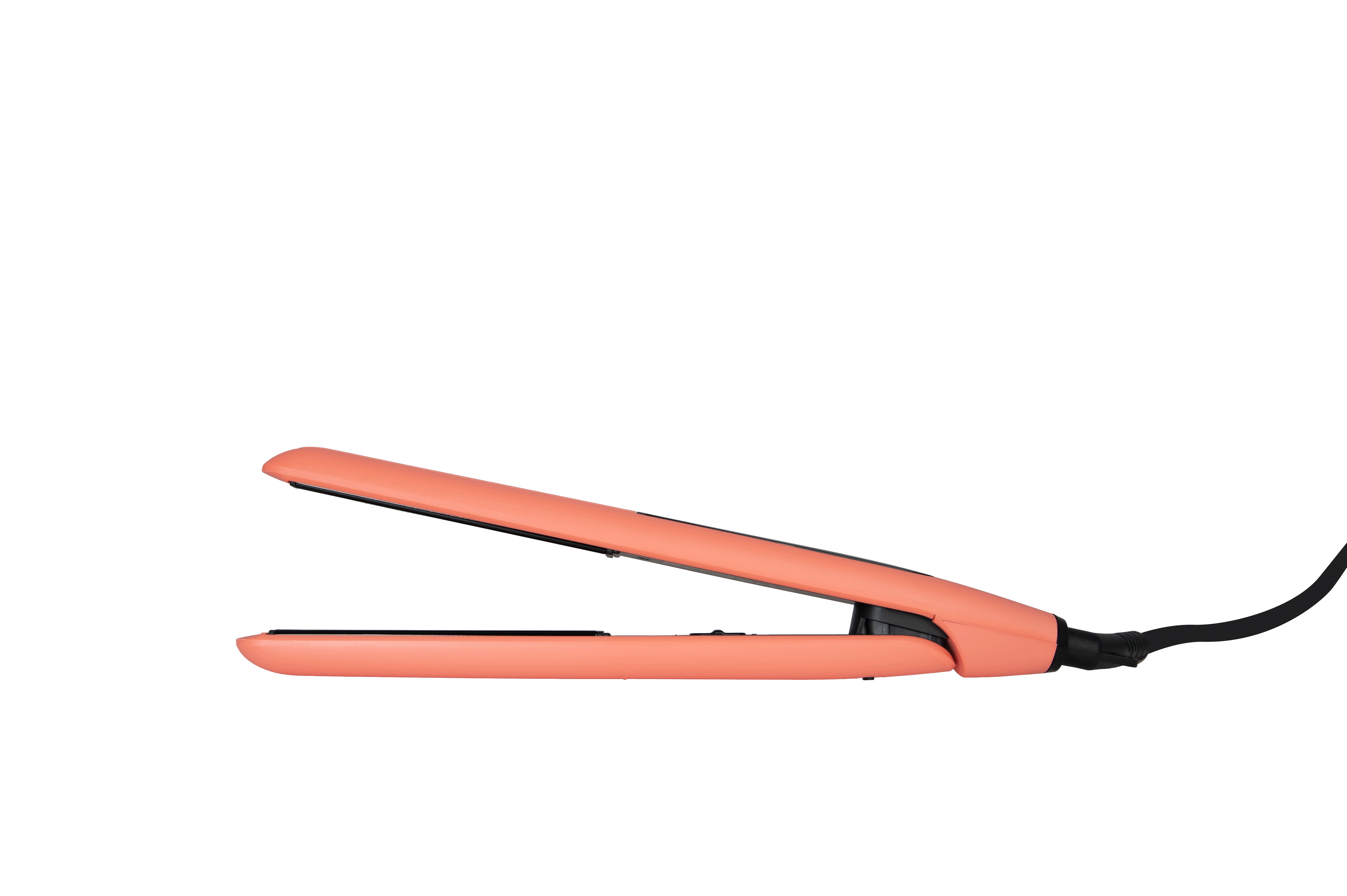 Una plancha de pelo de color melocotón con un cable negro sobre fondo negro.
