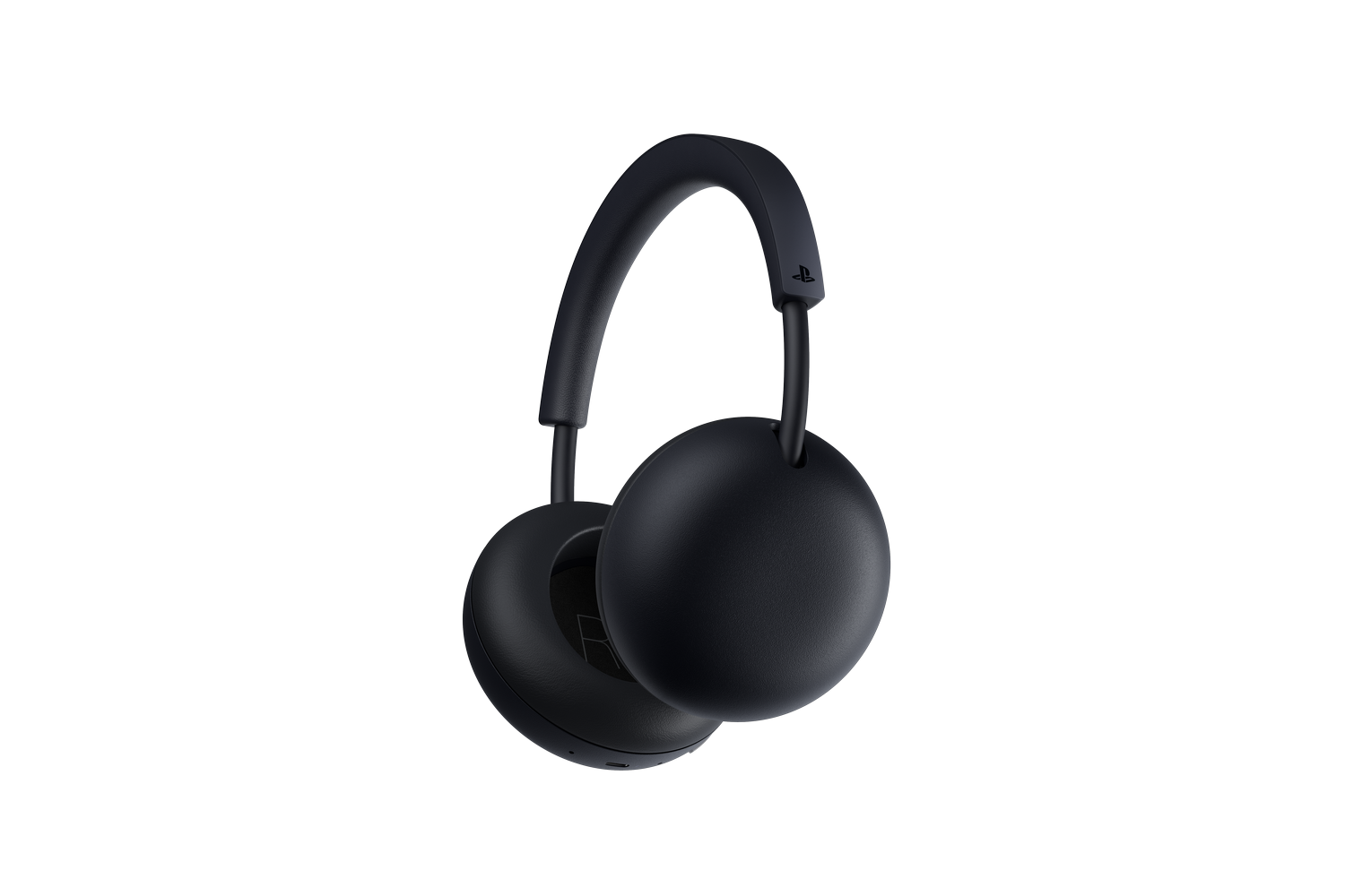 Auriculares inalámbricos para juegos de color negro sobre fondo negro.
