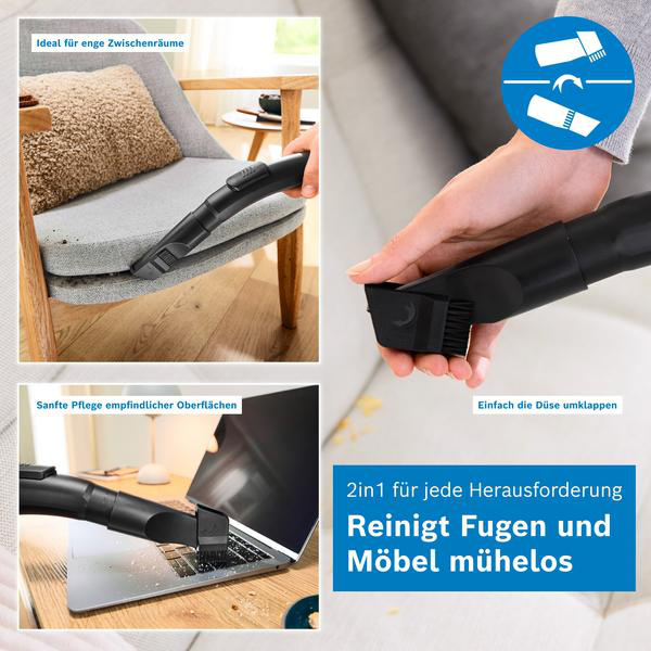 Eine Hand zeigt eine 2-in-1-Staubsaugerdüse, die für Stühle, Laptops und enge Fugen verwendet wird.