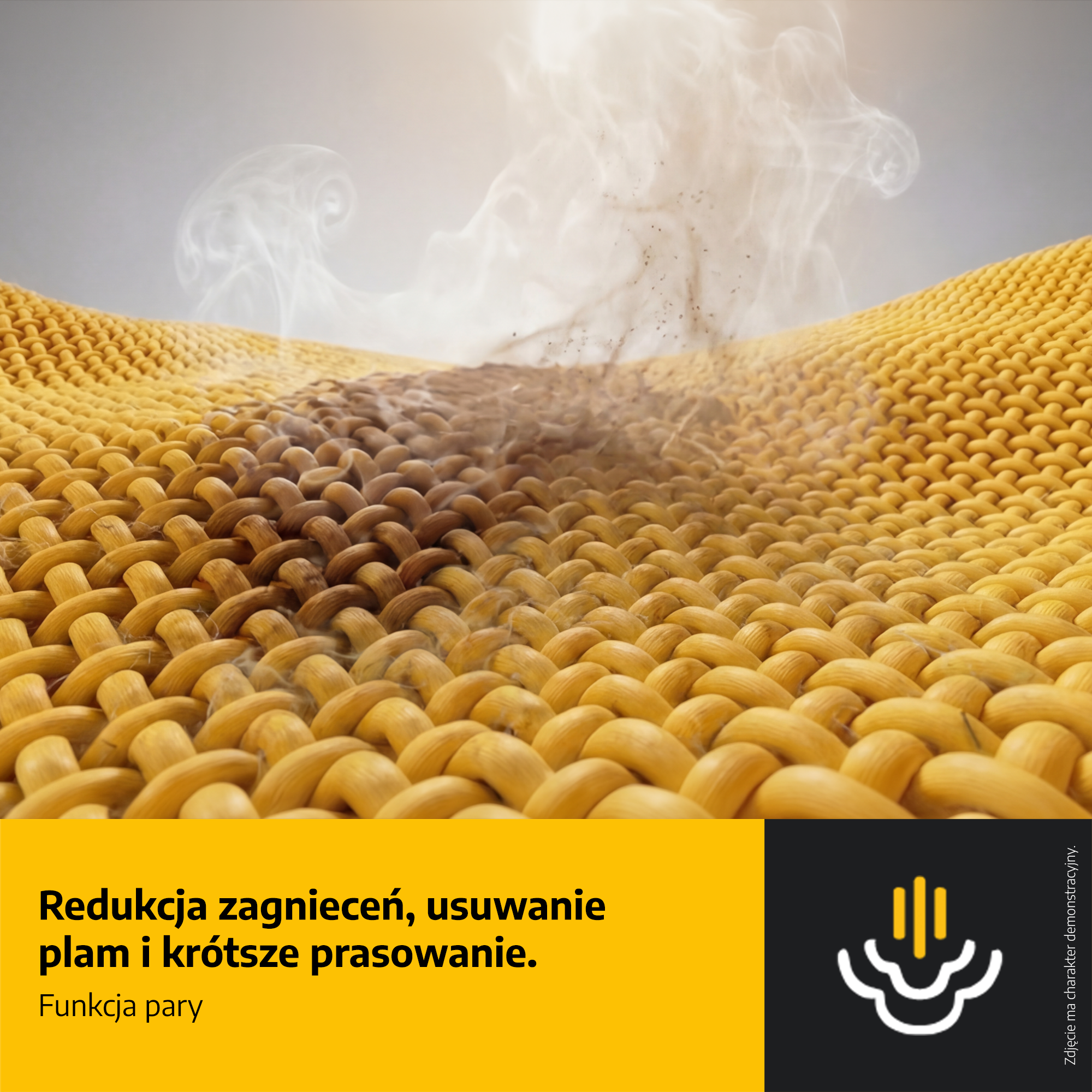 Zbliżenie żółtej dzianiny z ciemną plamą i unoszącą się parą oraz polskim tekstem na dole.