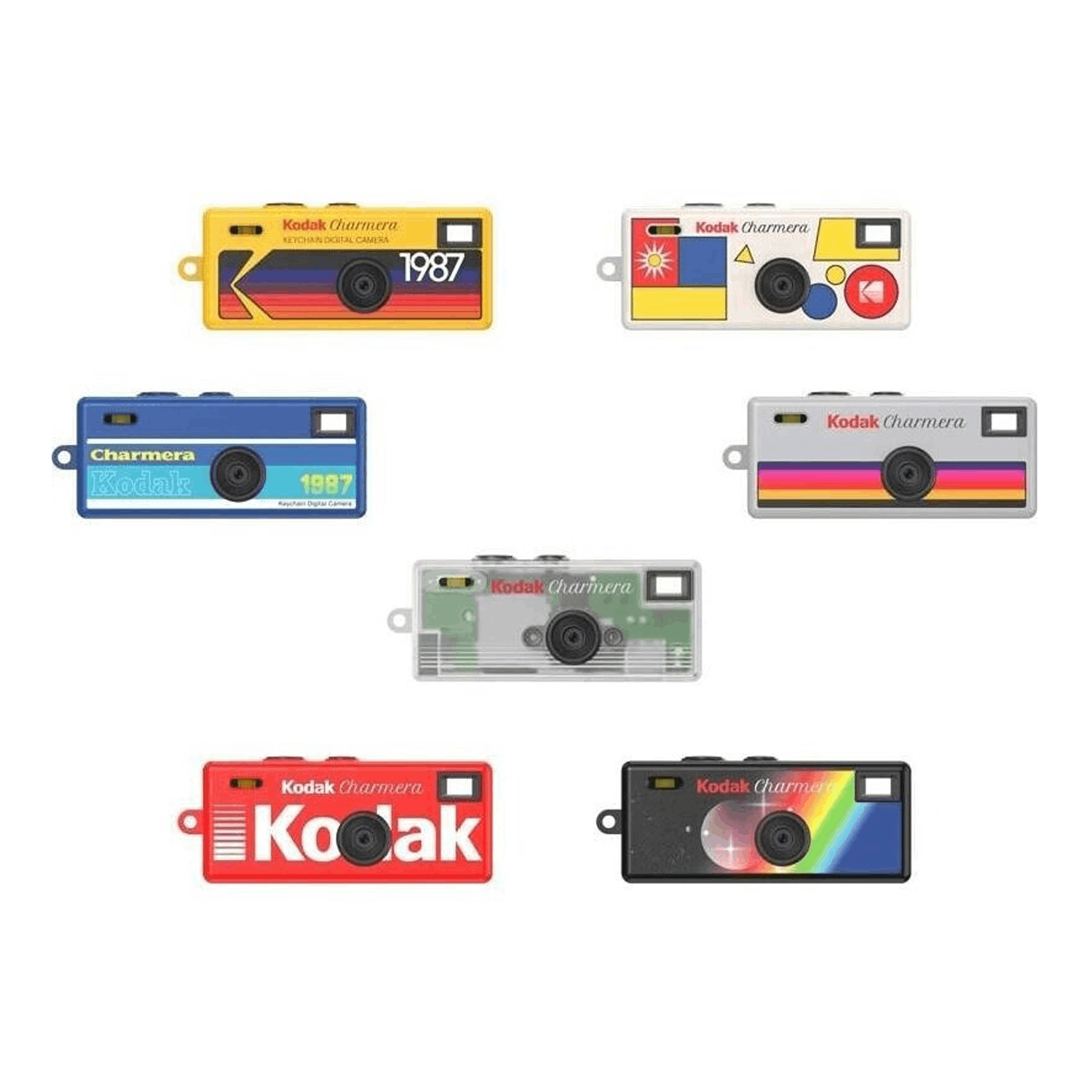 Siete diferentes cámaras digitales Kodak Charmera en miniatura sobre fondo blanco.