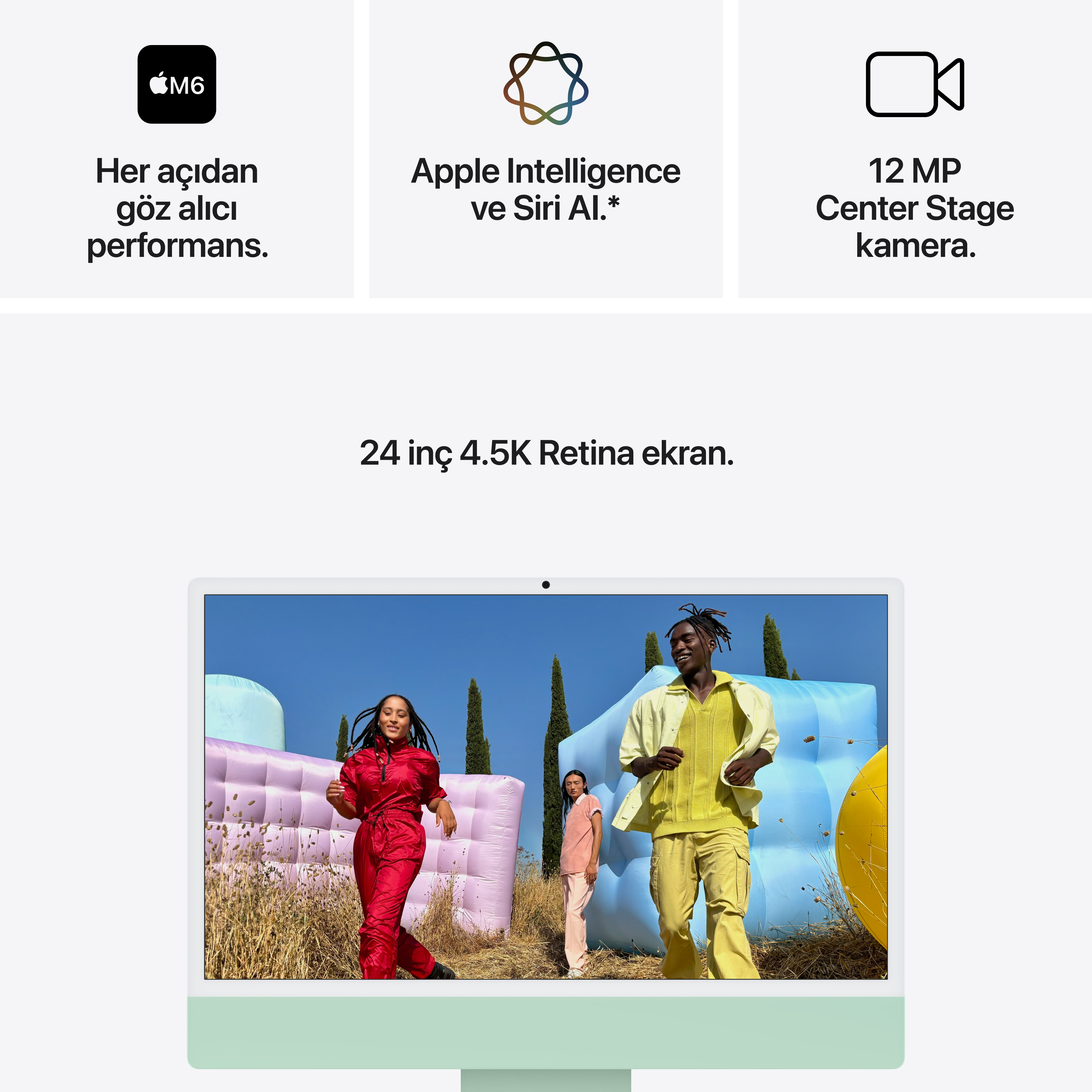 24 inç Retina ekranlı bir Mac, renkli şişme kalelerin önünde duran dört kişiyi gösteriyor.