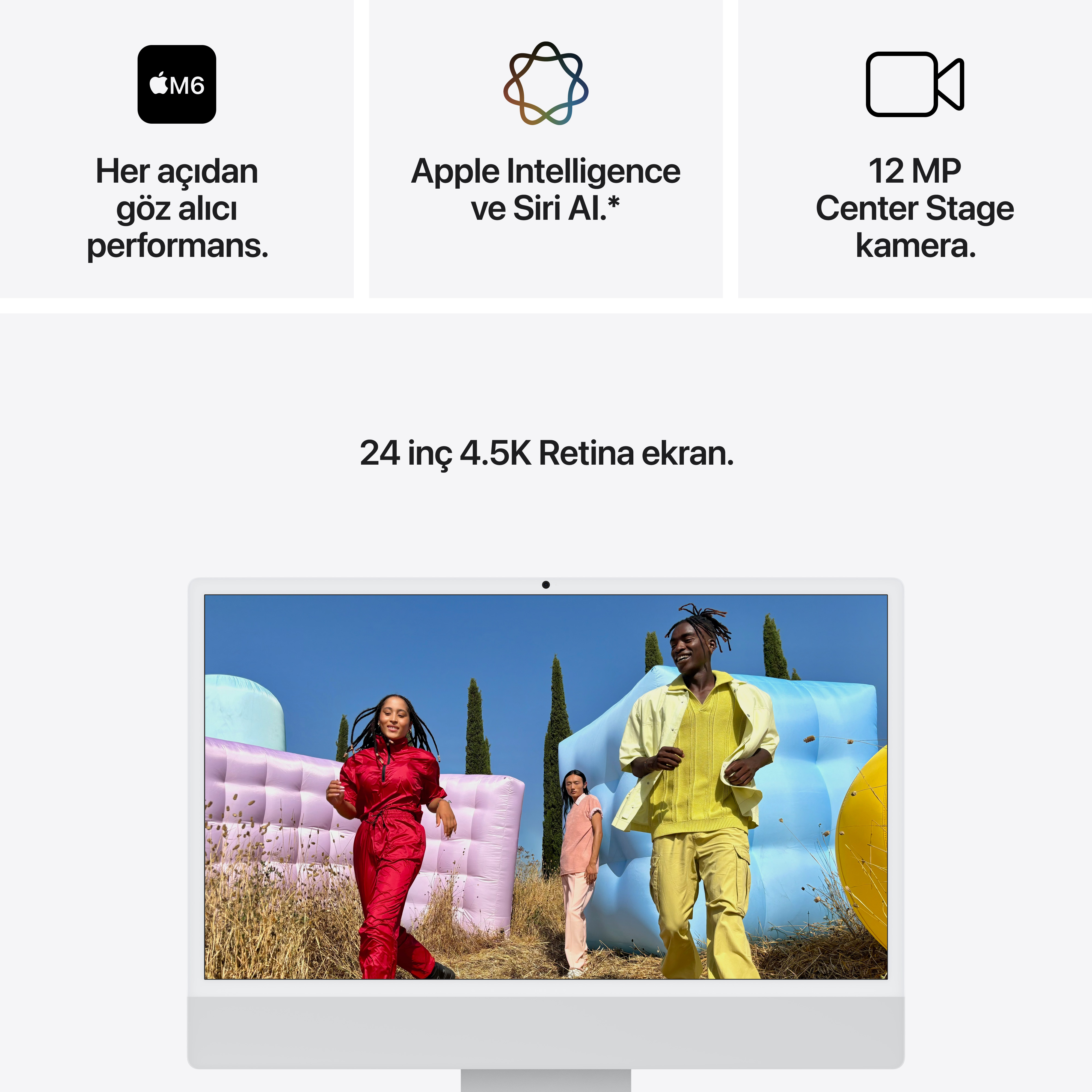 Bir iMac, renkli şişme oyun alanları önünde üç kişiyi, teknik özellikleri ve 24 inç Retina ekranı gösteriyor.
