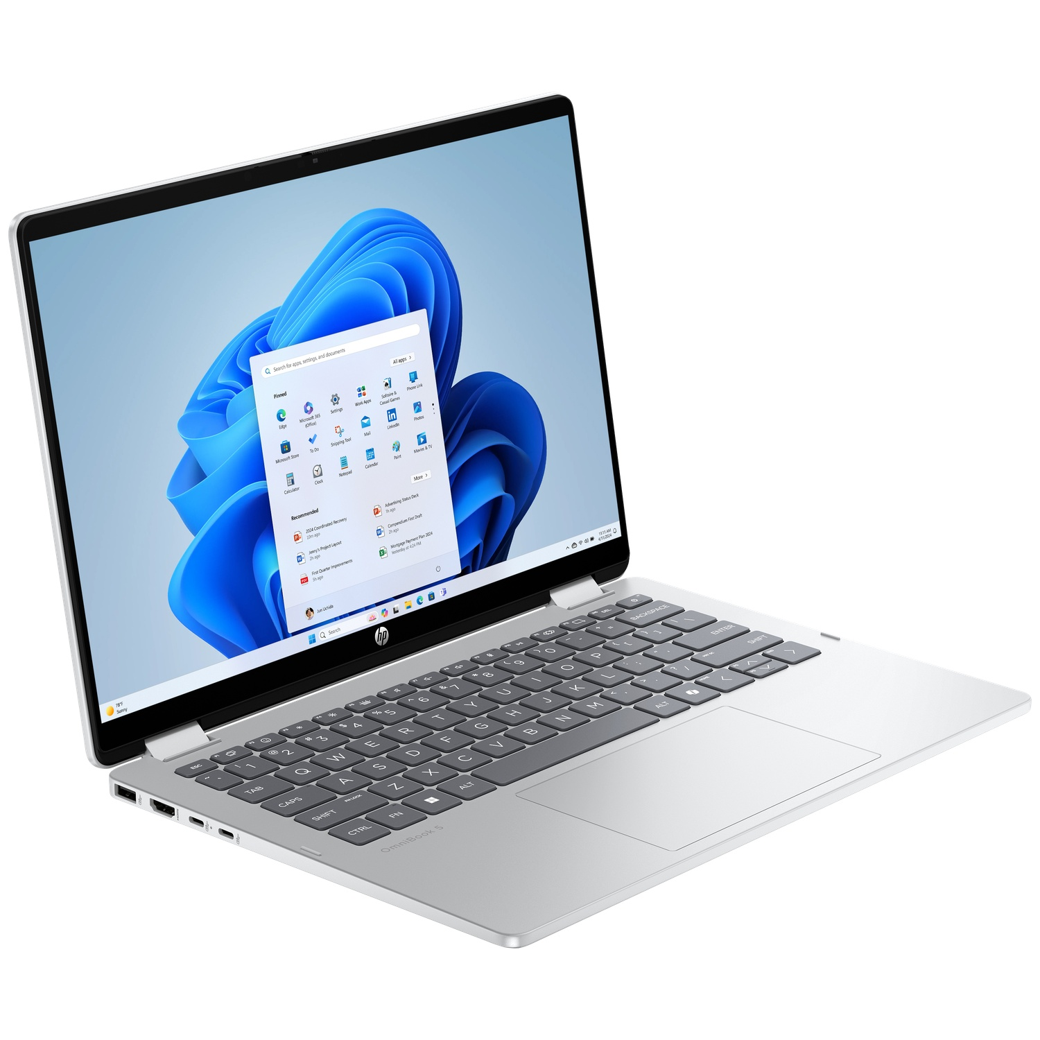Een zilveren HP-laptop met een open scherm toont het Windows 11-startmenu en een blauwe, abstracte achtergrond.
