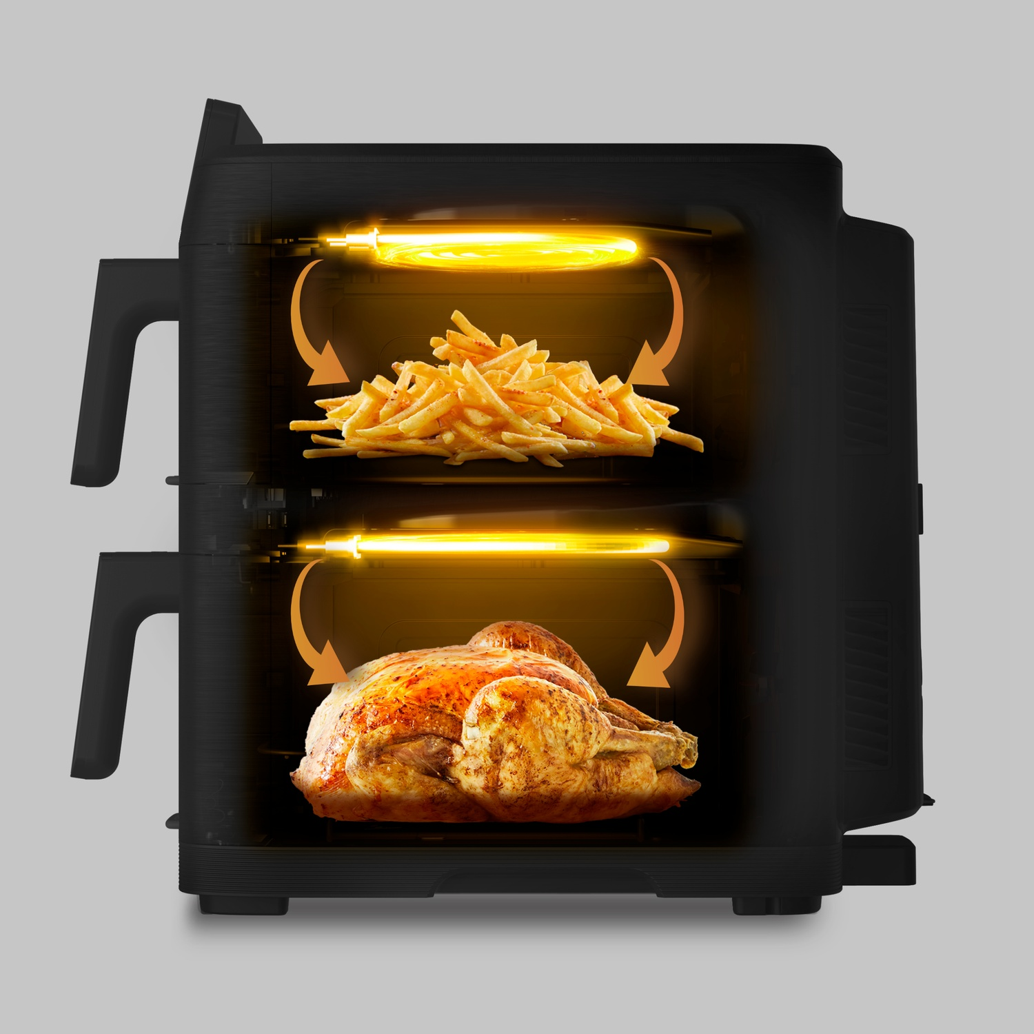 Friteuse à air à double zone avec des frites et un poulet.