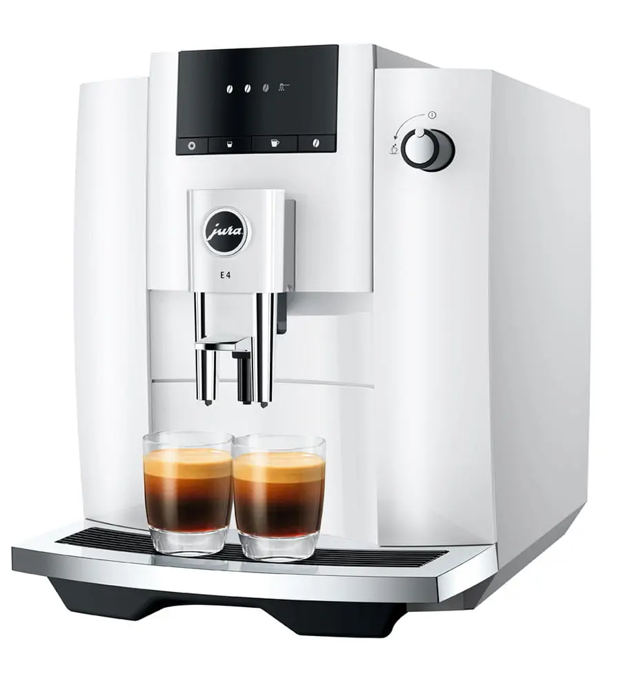 Una cafetera Jura E4 blanca con dos vasos de espresso en la bandeja.
