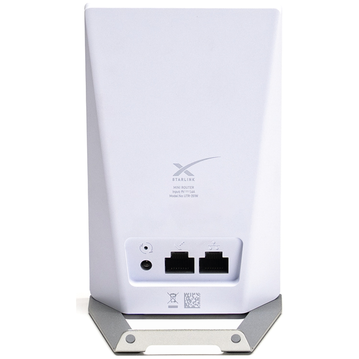 Achteraanzicht van een witte Starlink mini-router met poorten en grijze standaard op witte achtergrond.