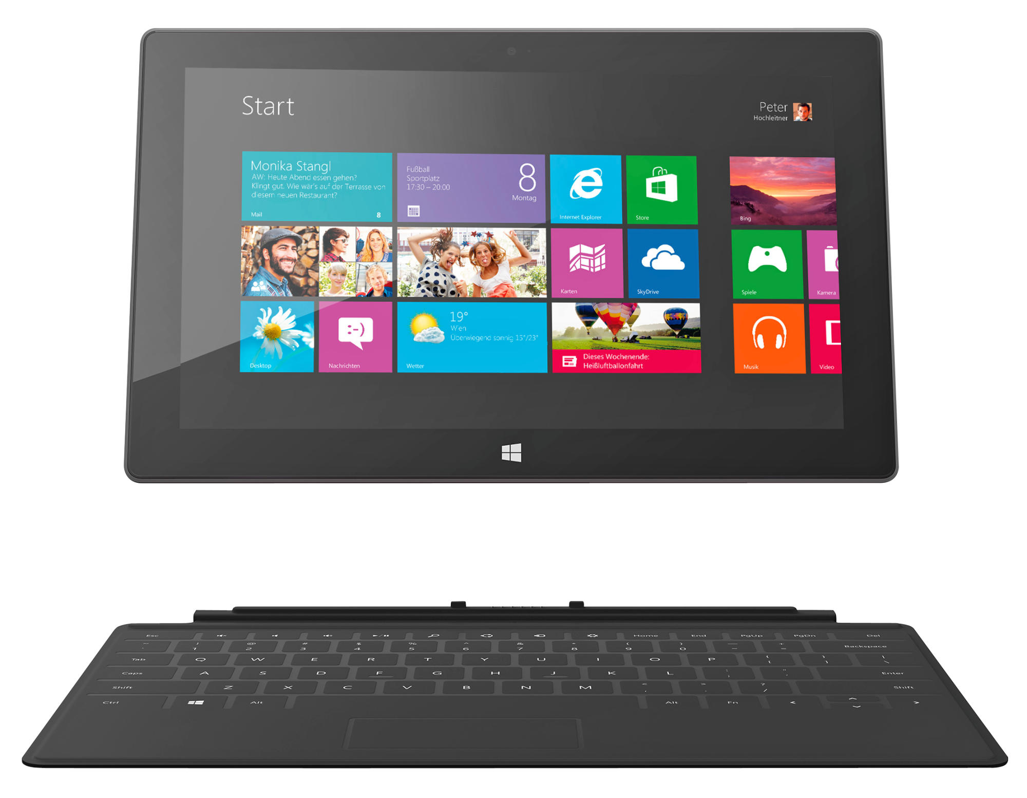 Tablet mit Tastatur. Windows 8 Oberfläche, lila Startbildschirm mit Symbolen.