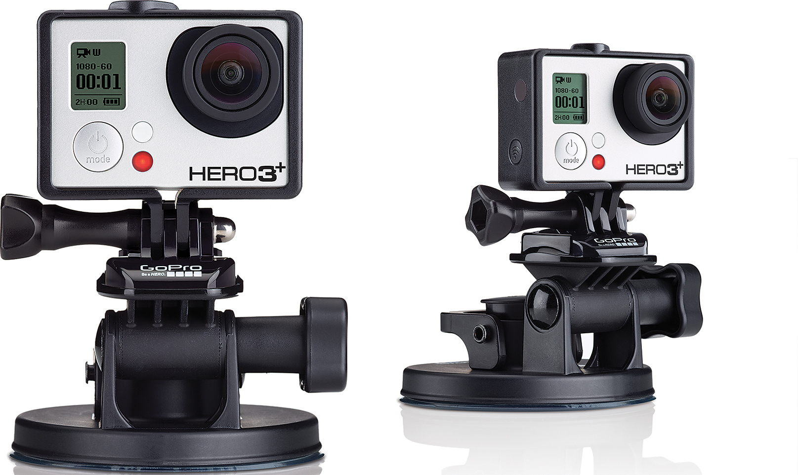 Zwei GoPro Hero3+ Kameras auf Saugnäpfen. Weiße und schwarze Kameras mit Objektiven und Displays sind sichtbar.
