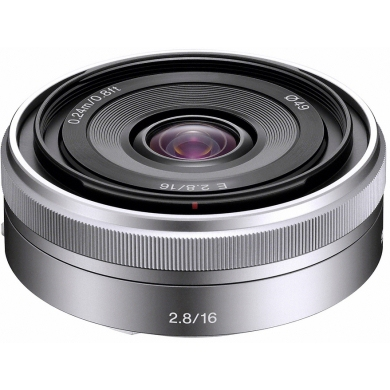 Silver camera lens with focus ring and aperture marking, close-up view.