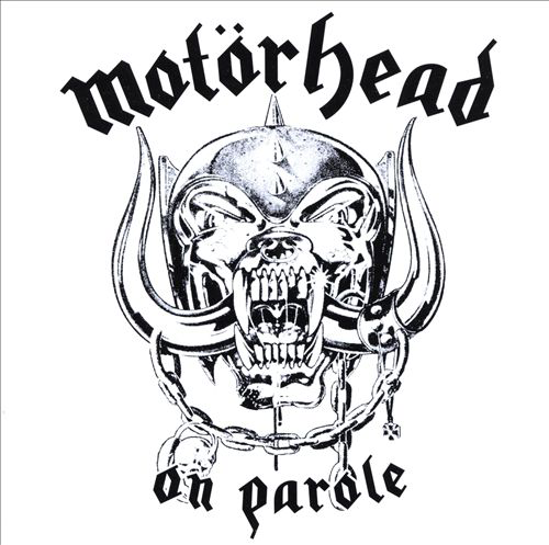 Album borító. Fekete-fehér kép egy démoni arc éles fogakkal. Felül a Motörhead cím.