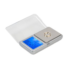 Une balance numérique avec une bague dessus et un couvercle transparent.