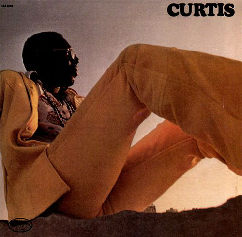 Album borító. Egy sárga ruhás férfi fekszik. Cím: Curtis.